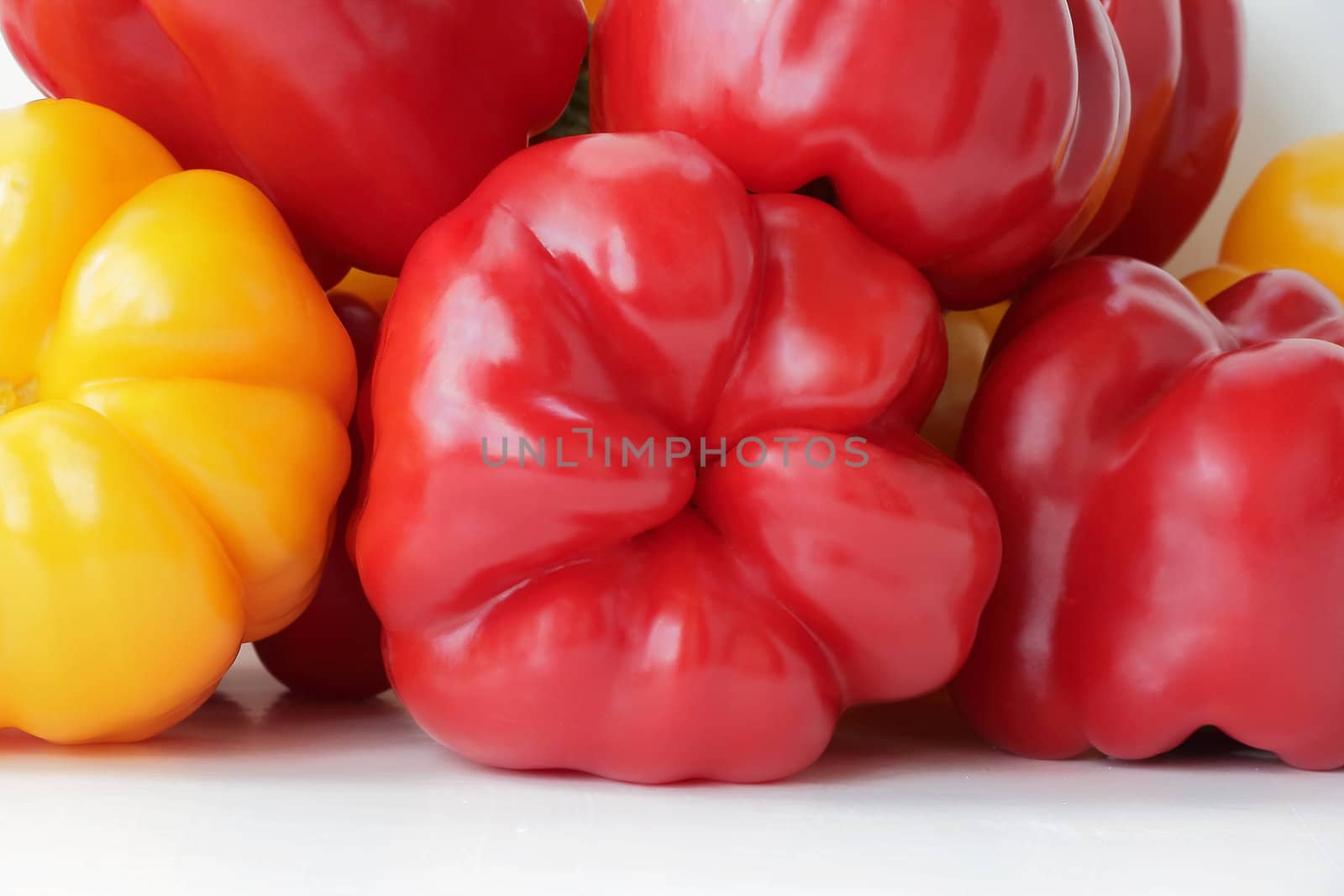 Image of red and yellow raw pepper