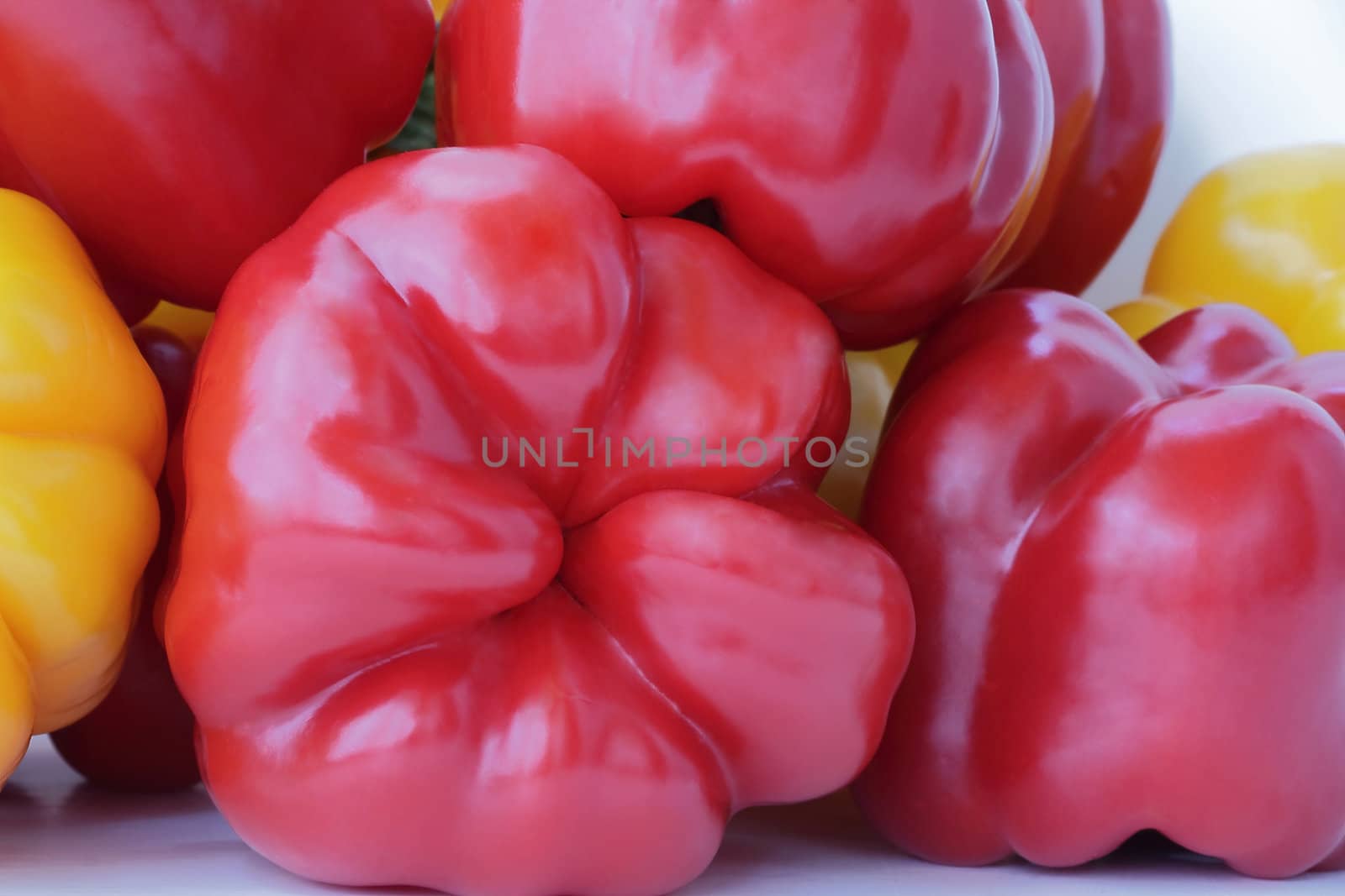 Image of red and yellow raw pepper