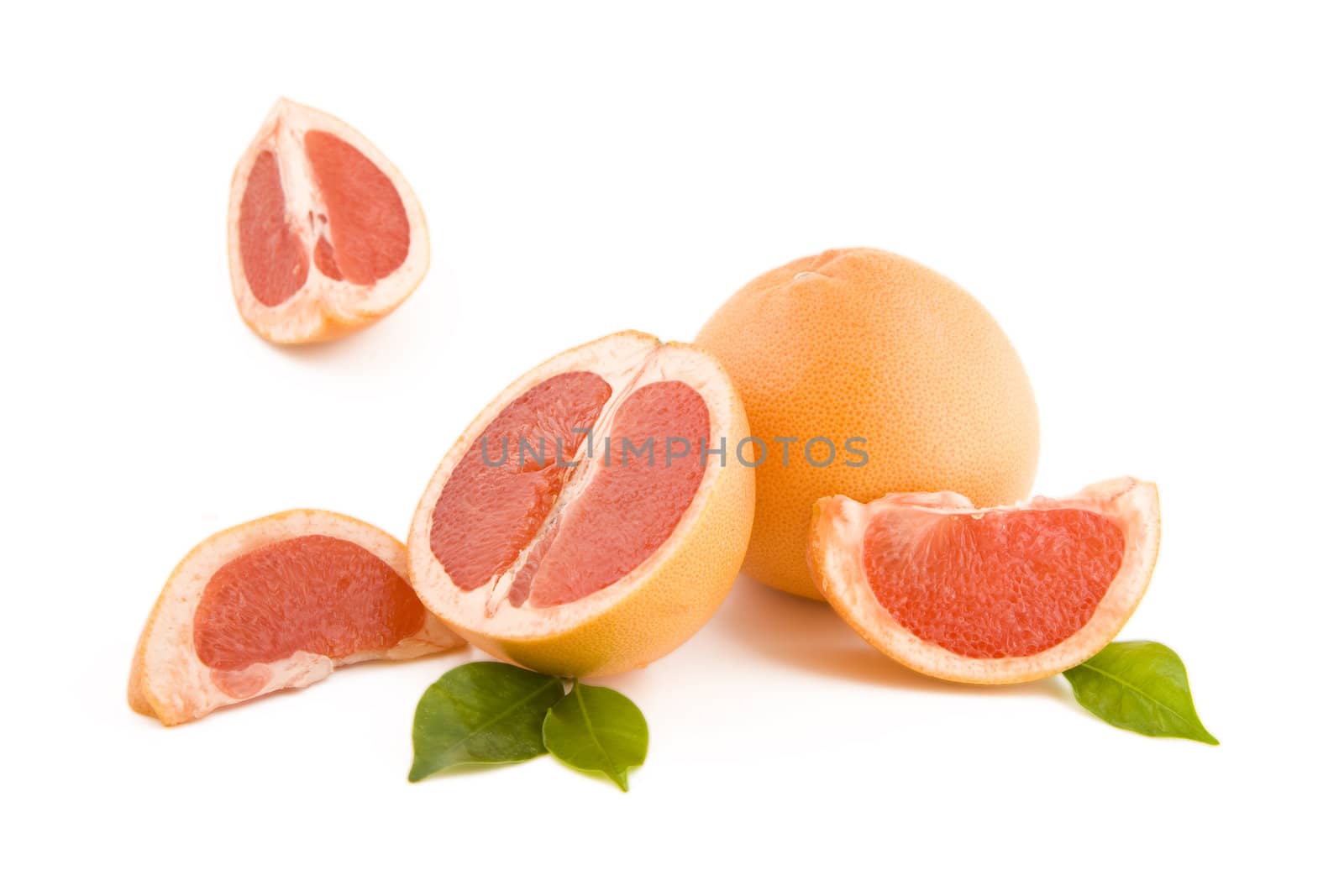 Fresh peeled red grapefruits isolated on white
