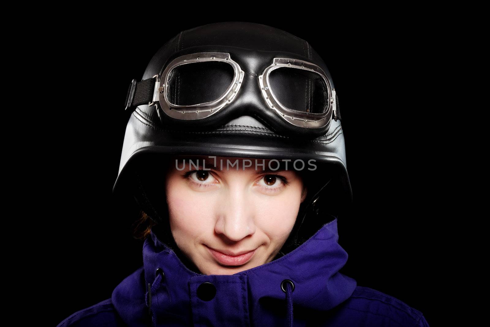 girl with us-army style helmet and goggles, on black