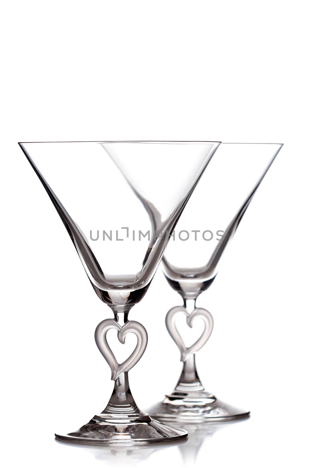 empty martini heart shaped glasses, isolated on white