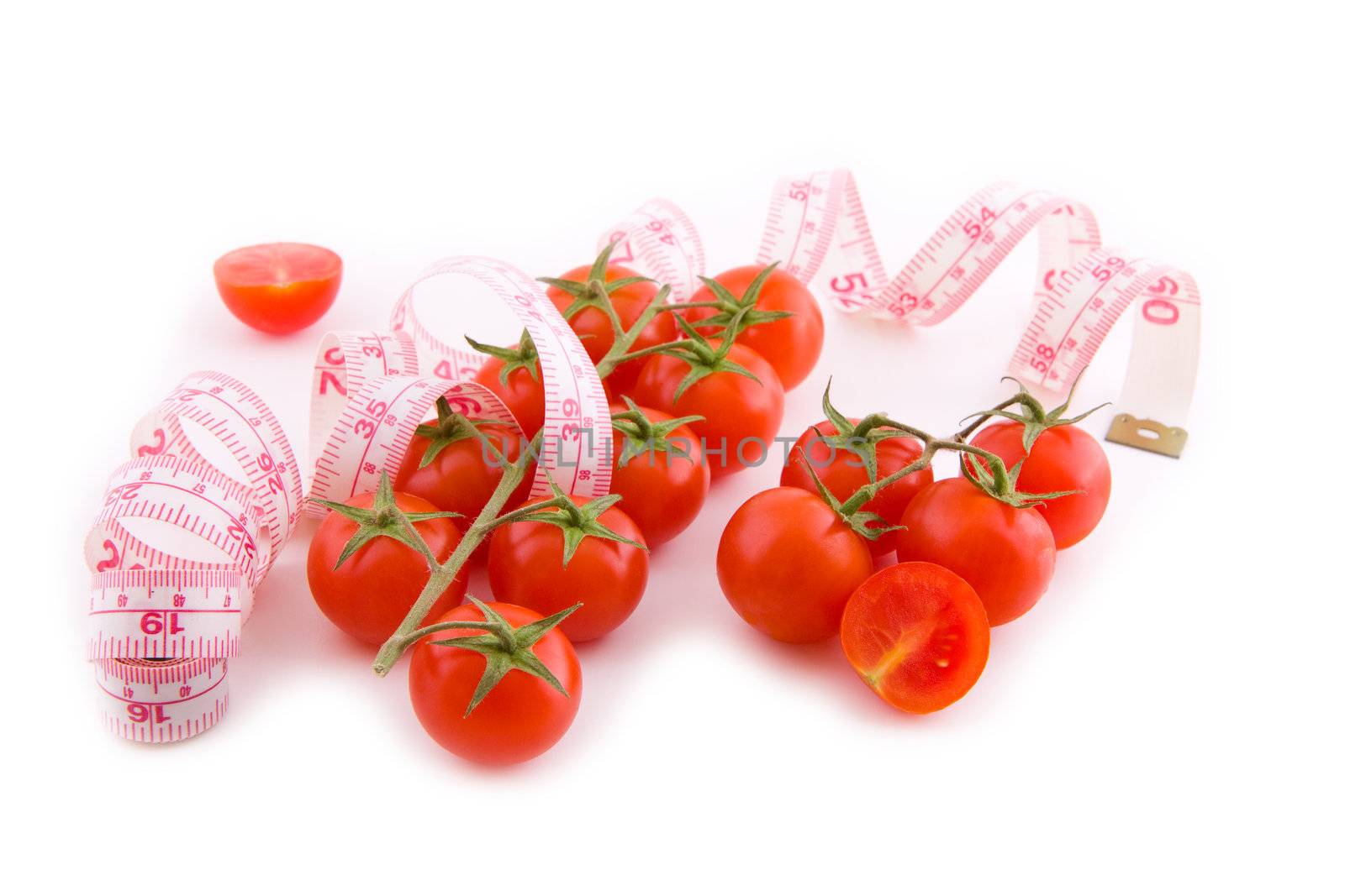 Small bunch of tomatoes with measure fitness tape on white