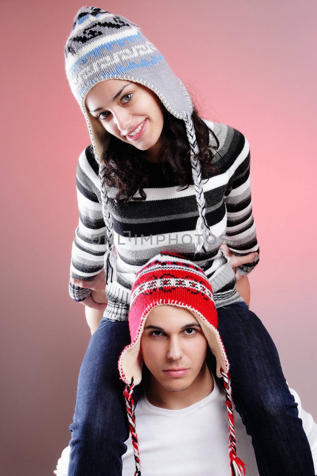 attractive young winter couple having some fun