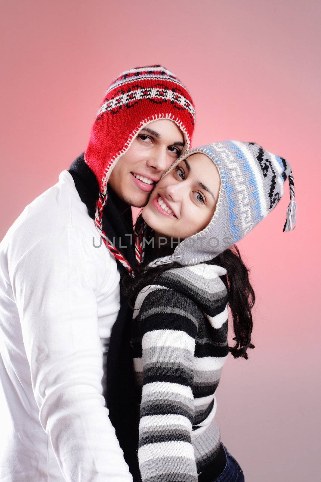 attractive young winter couple having some fun
