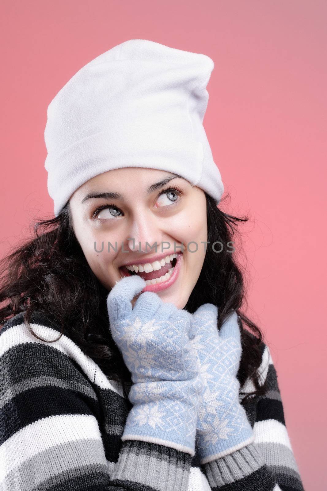 portrait of a beautiful young girl smiling, on pink background