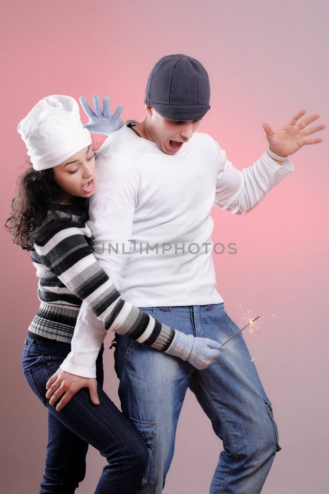 attractive young winter couple having some fun