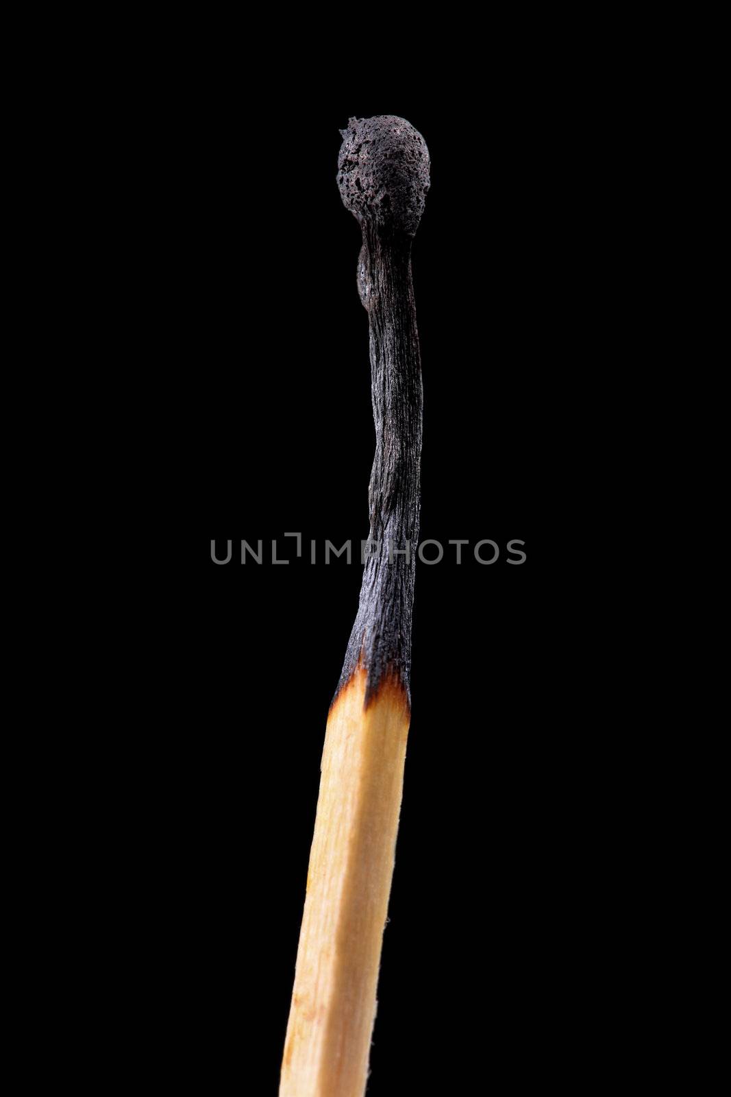 used match stick isolated on black background