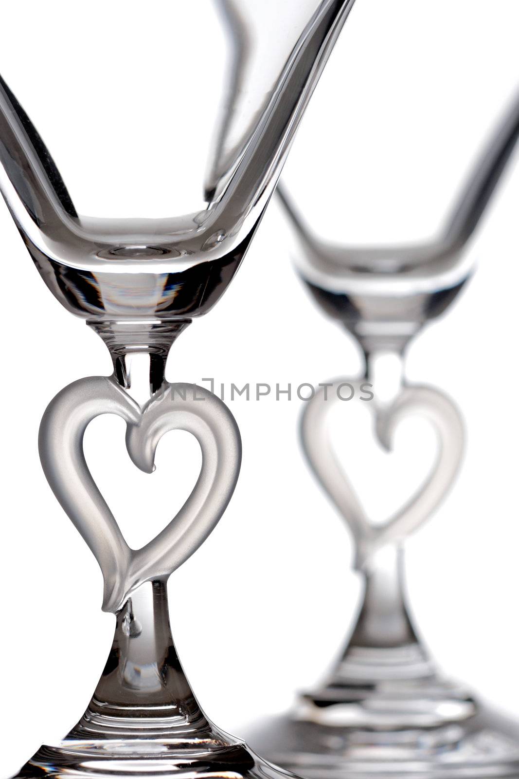 empty martini heart shaped glasses, isolated on white