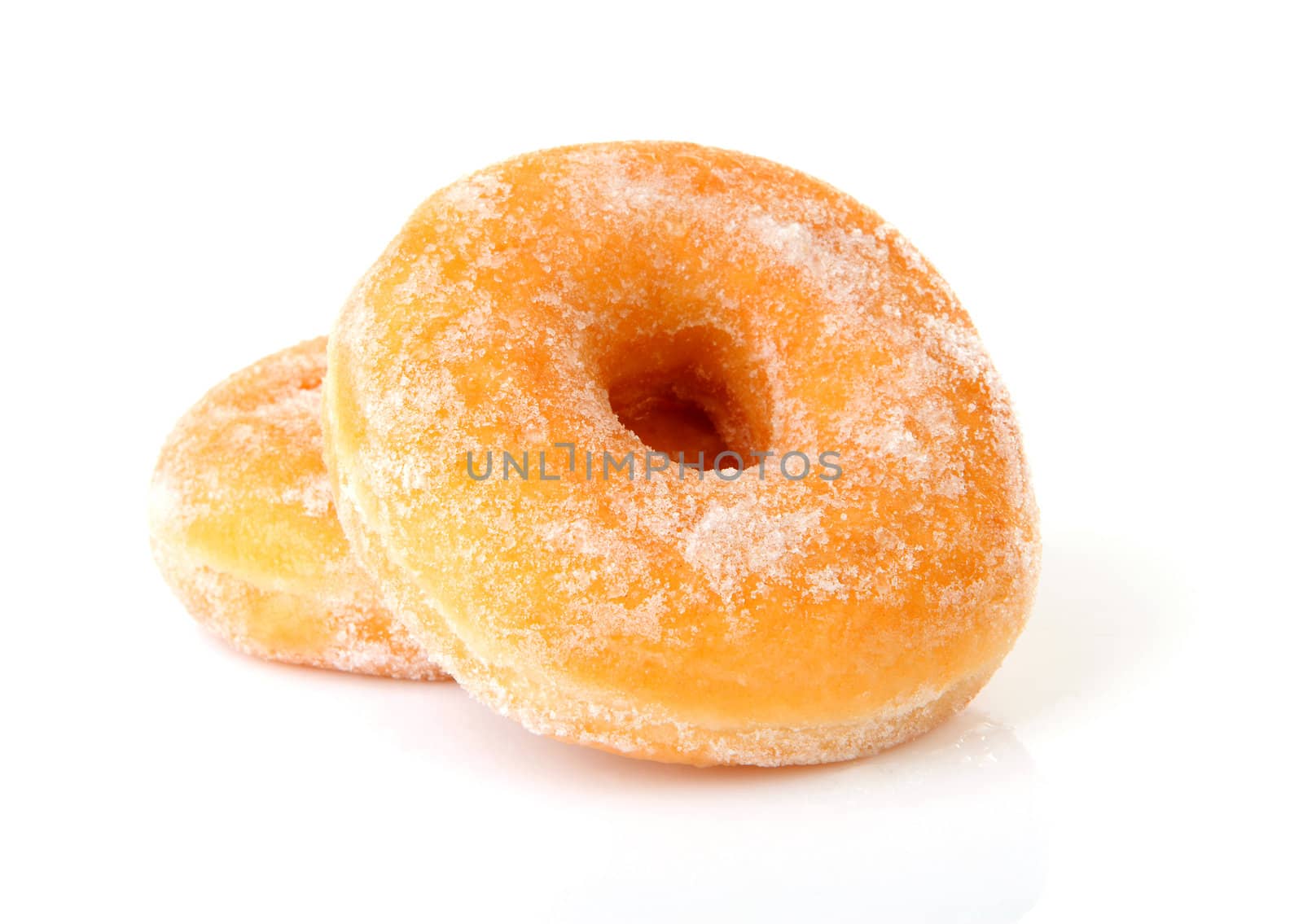 Two delicious sugared donuts over white background