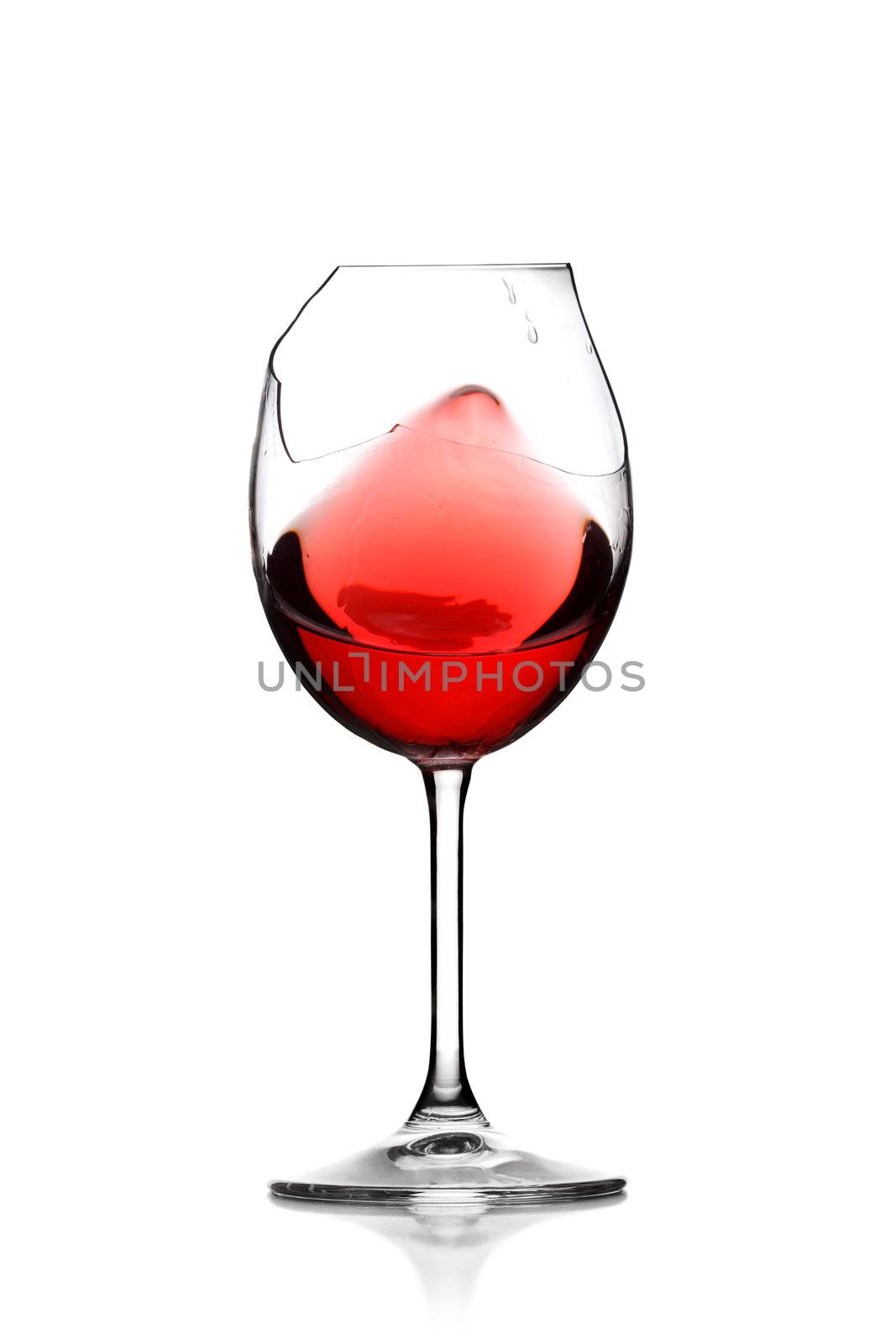red wine in broken glass by kokimk