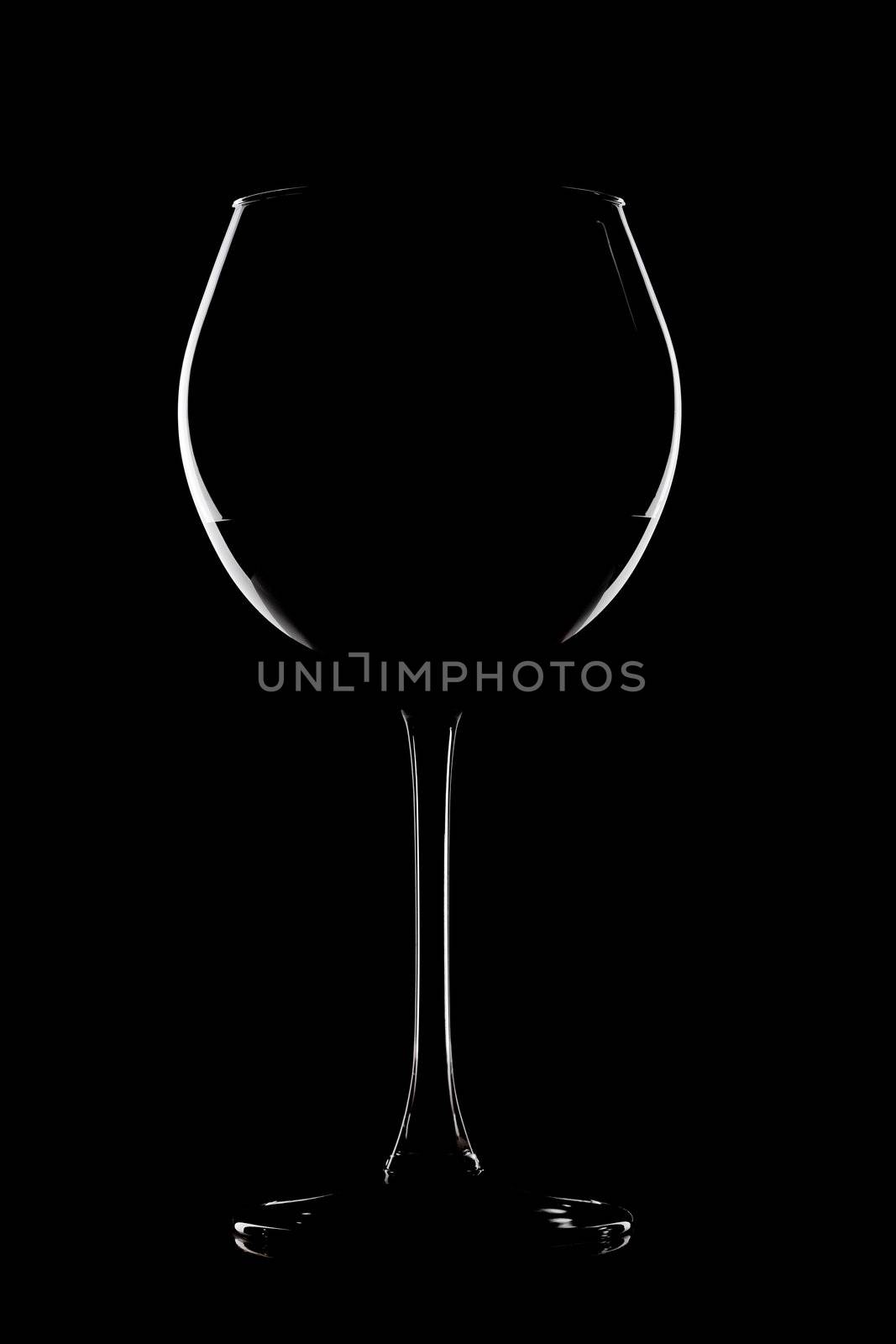 abstract wine glass contour against black background
