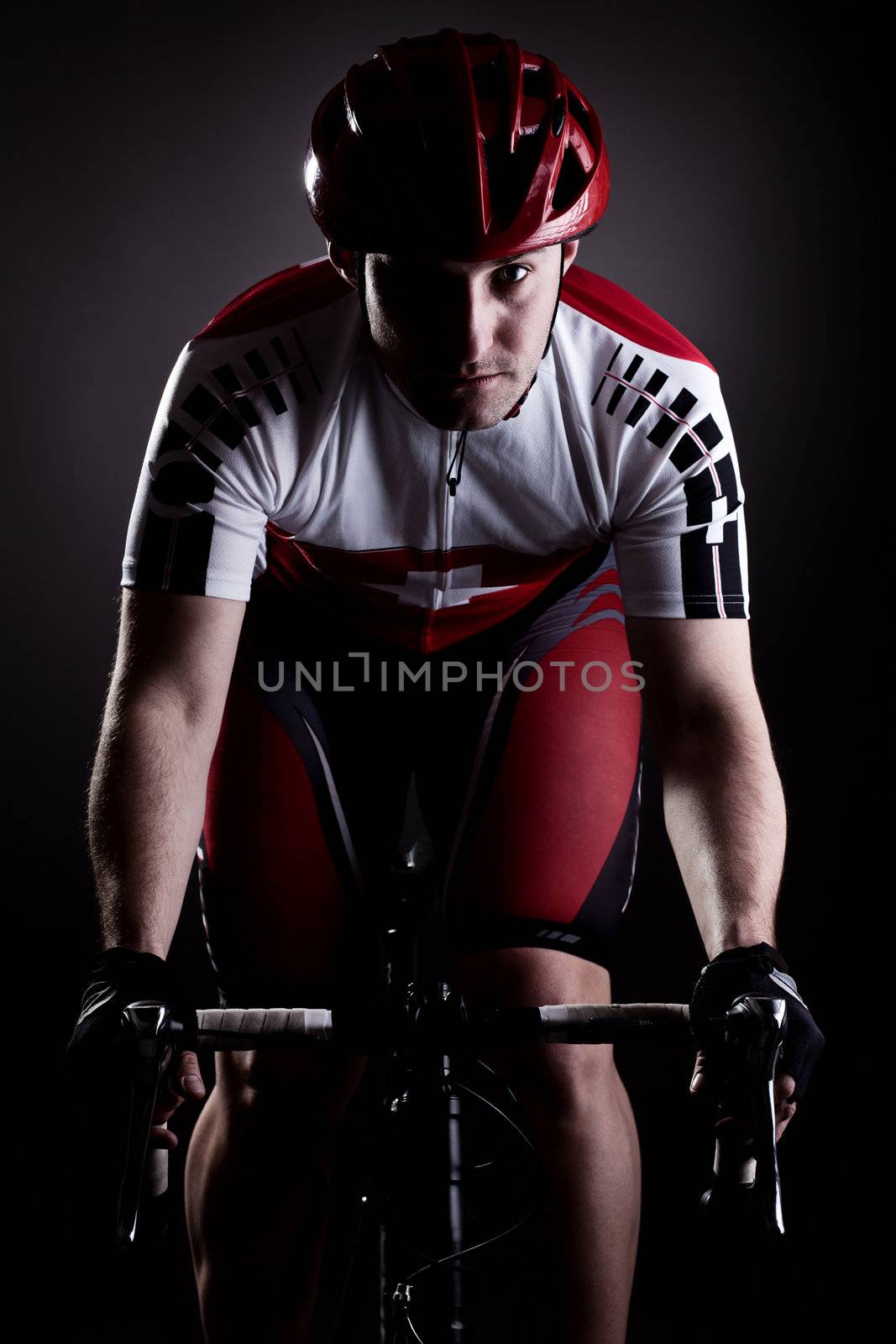 fully equipped cyclist riding a bicycle