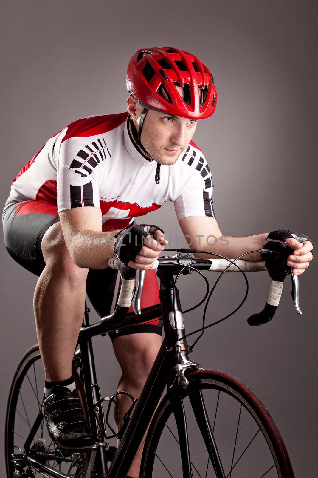 fully equipped cyclist riding a bicycle