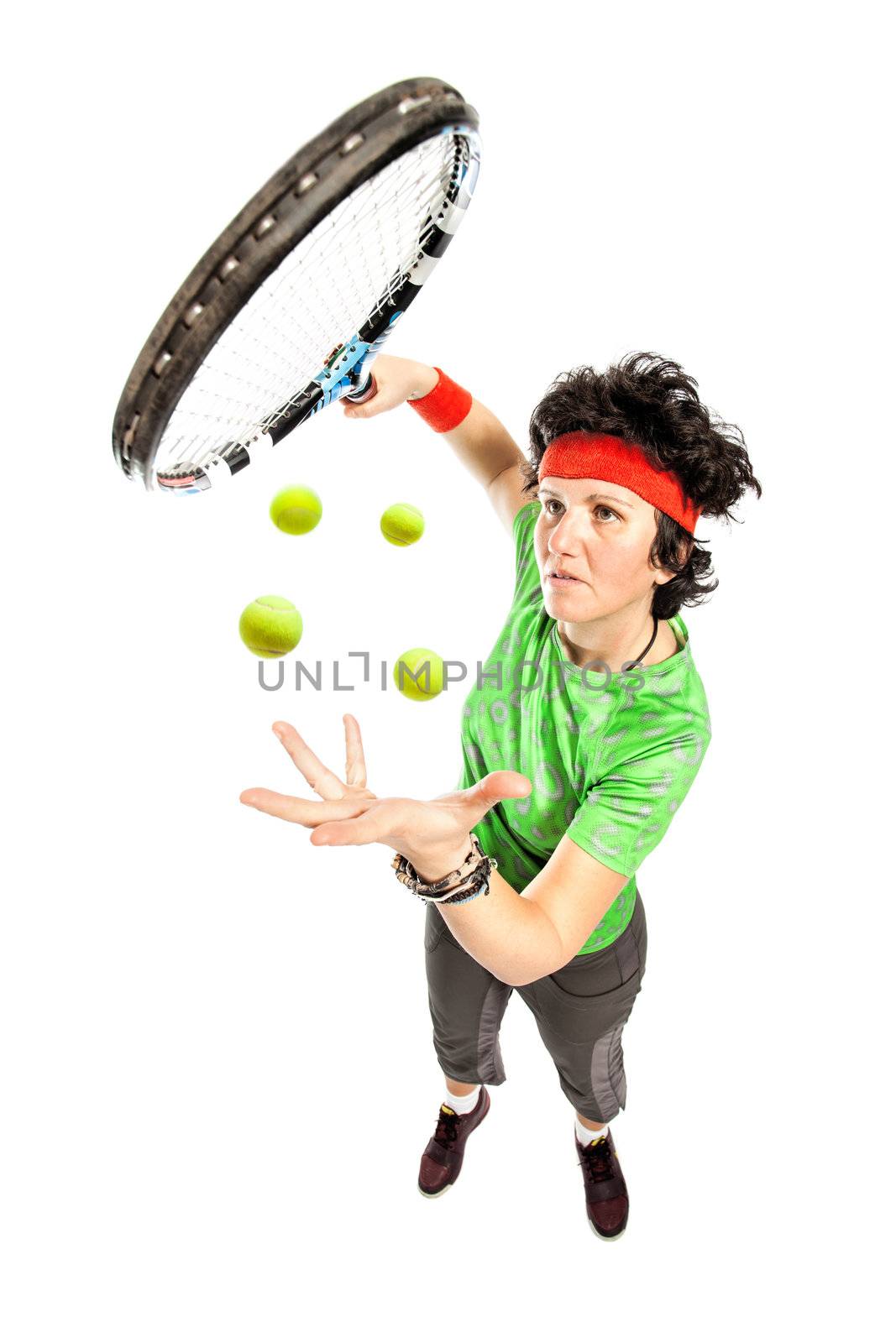 Female tennis player performing magic trick isolated on white background