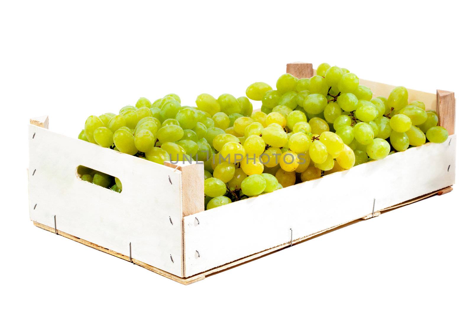 Ripe green grapes in a wooden crate box isolated