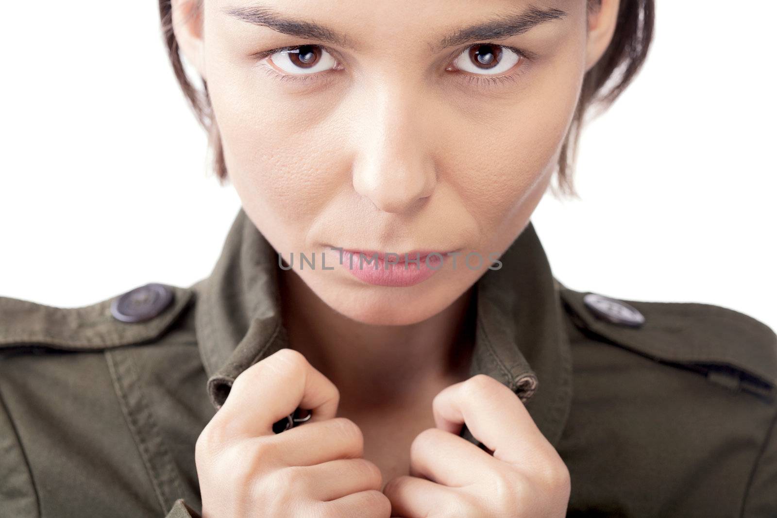 portrait of a serious female in jacket against white