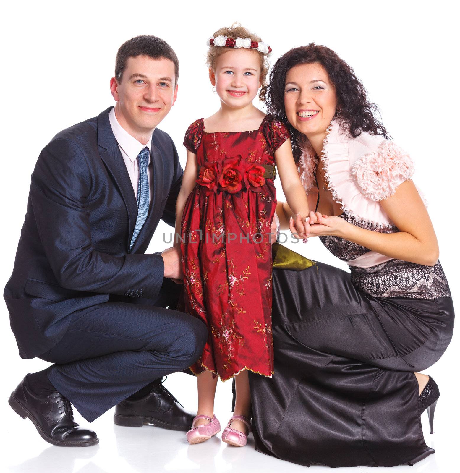 Beautiful middle aged couple with cute daughter smiling over white background