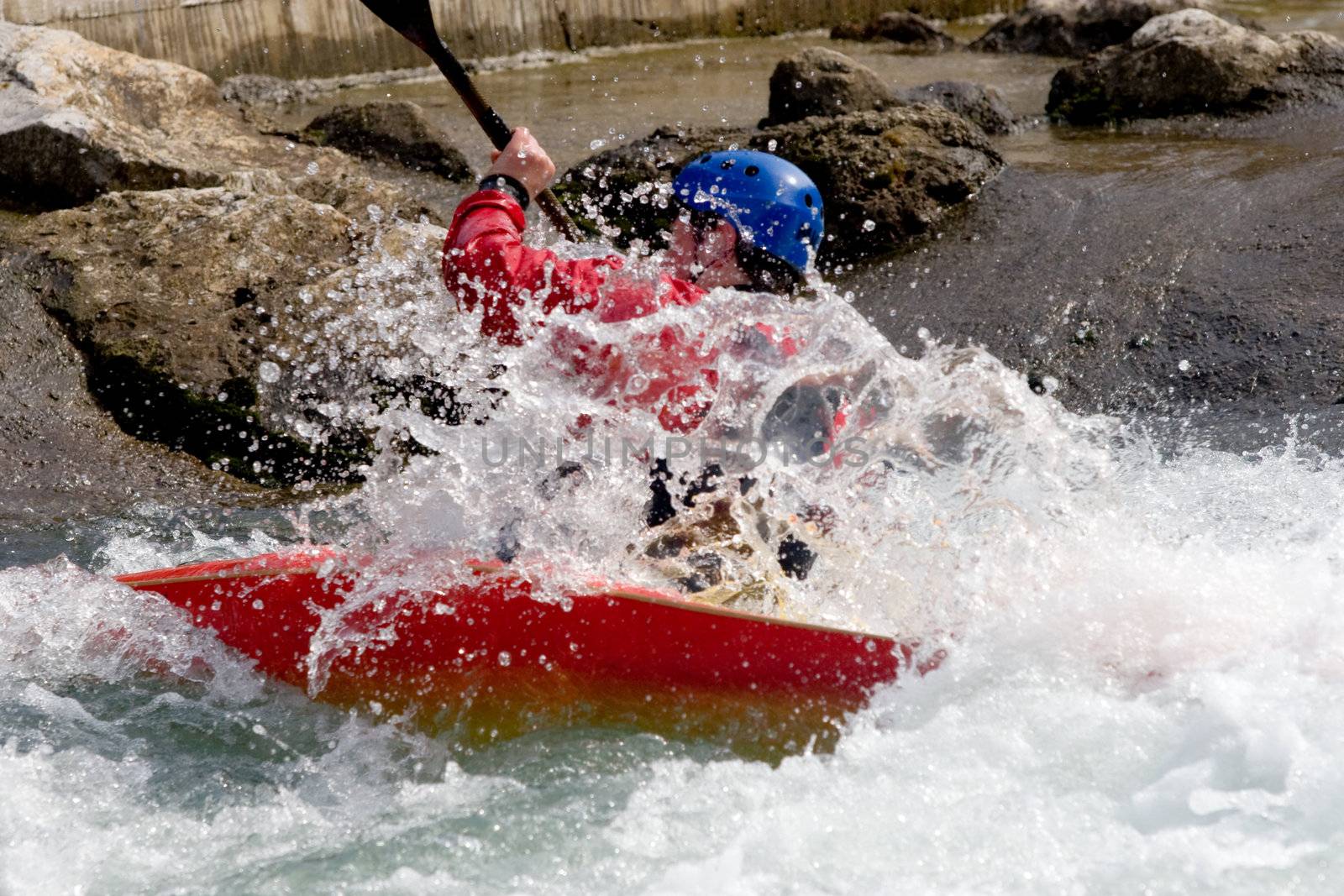 kayaker manoeuvring in white water