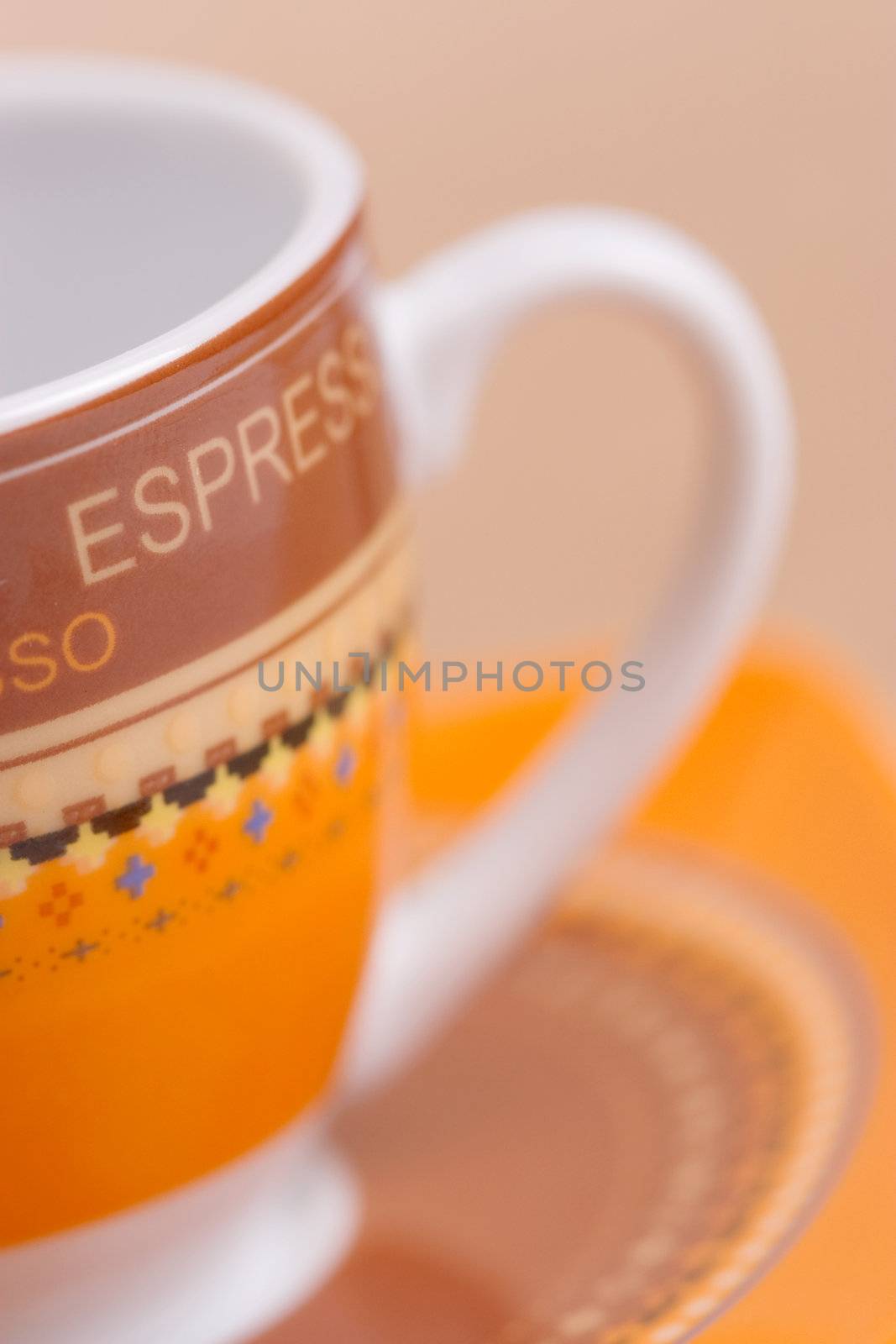 orange espresso cup, shallow depth of field