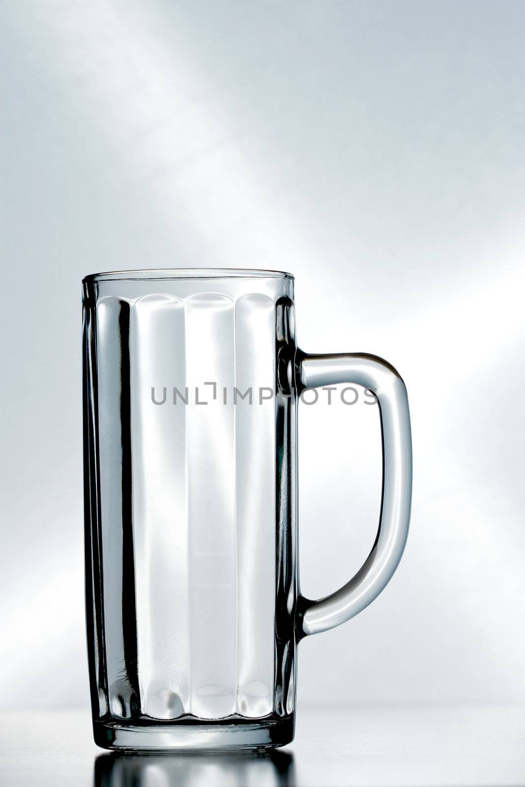 an empty beer glass by kokimk