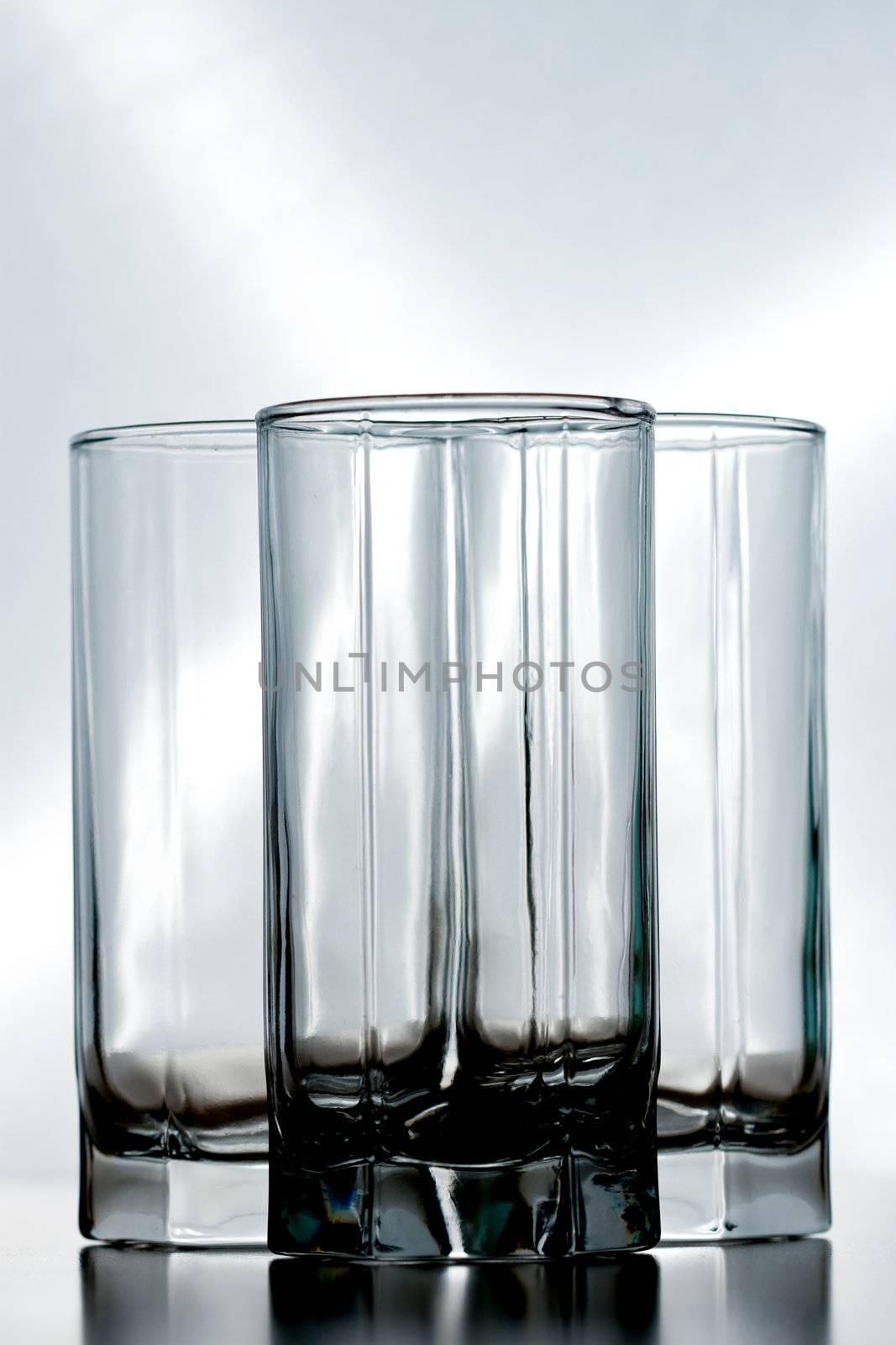 three empty crystal glasses