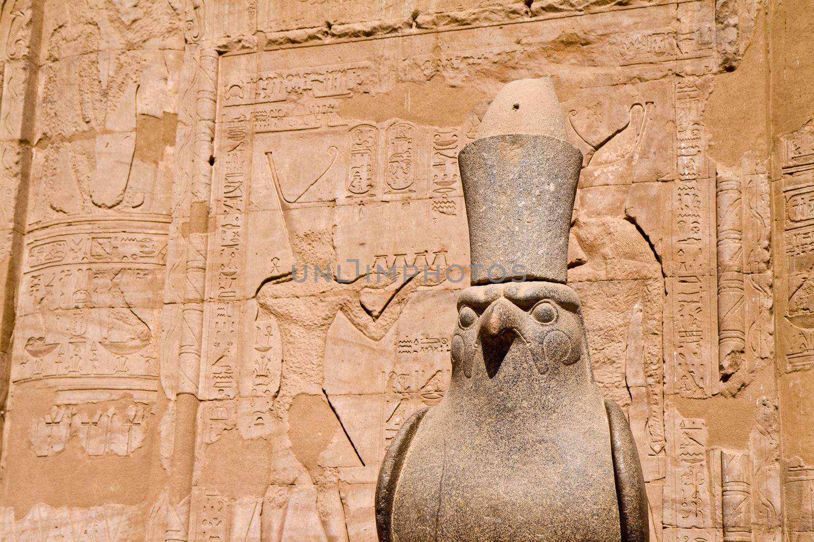 Ancient stone statue in Egyptian temple, incarnation of Pharaoh