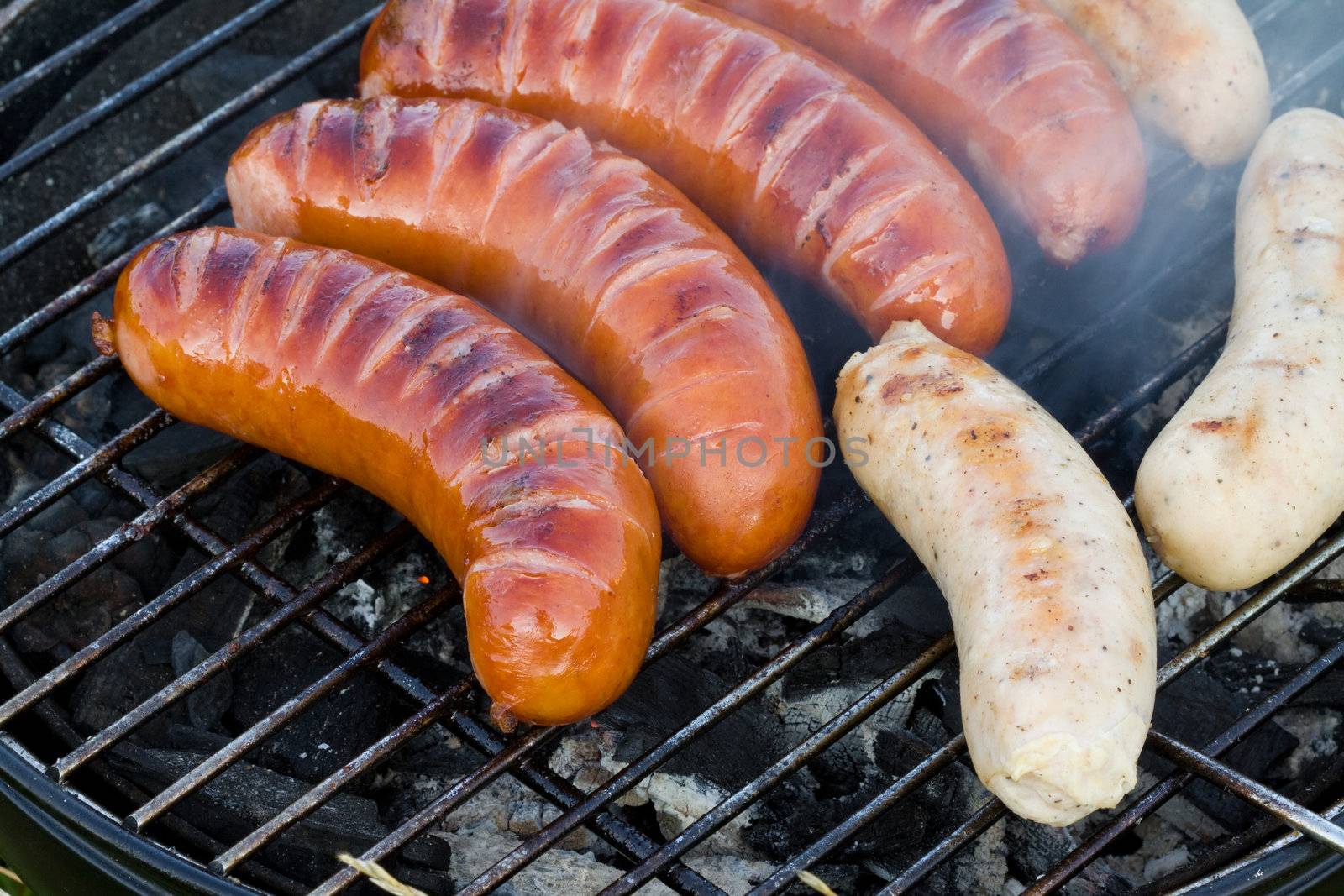 Sausages on the grill by Gbuglok