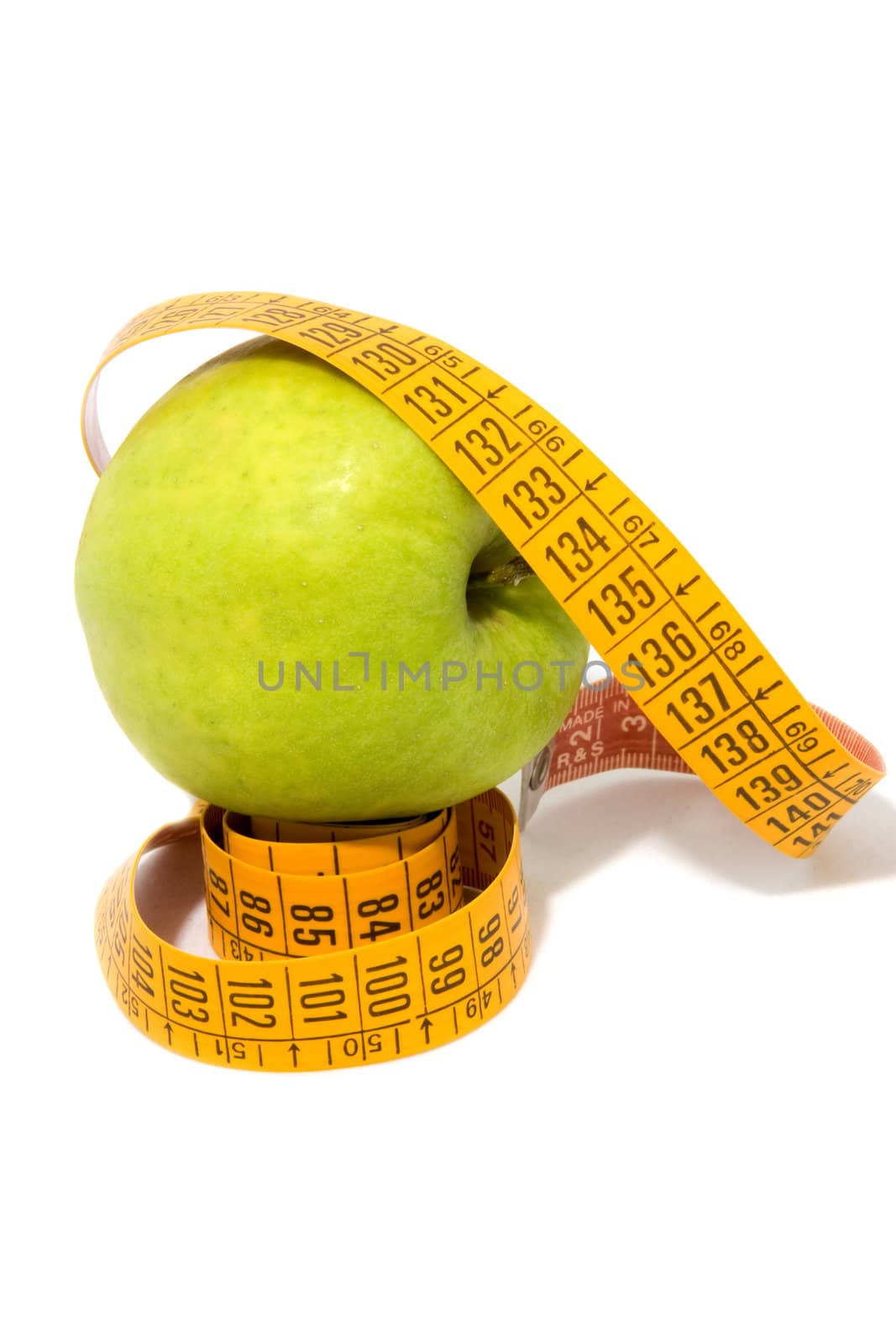 Apple with measure tape isolated on white background
