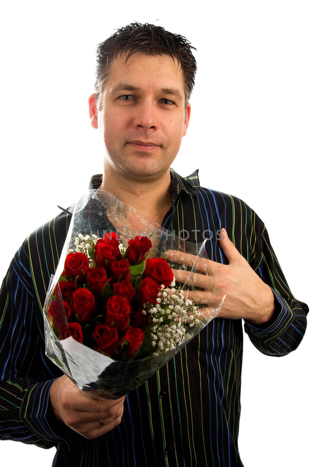 Young man in love is giving red roses, isolated on white background