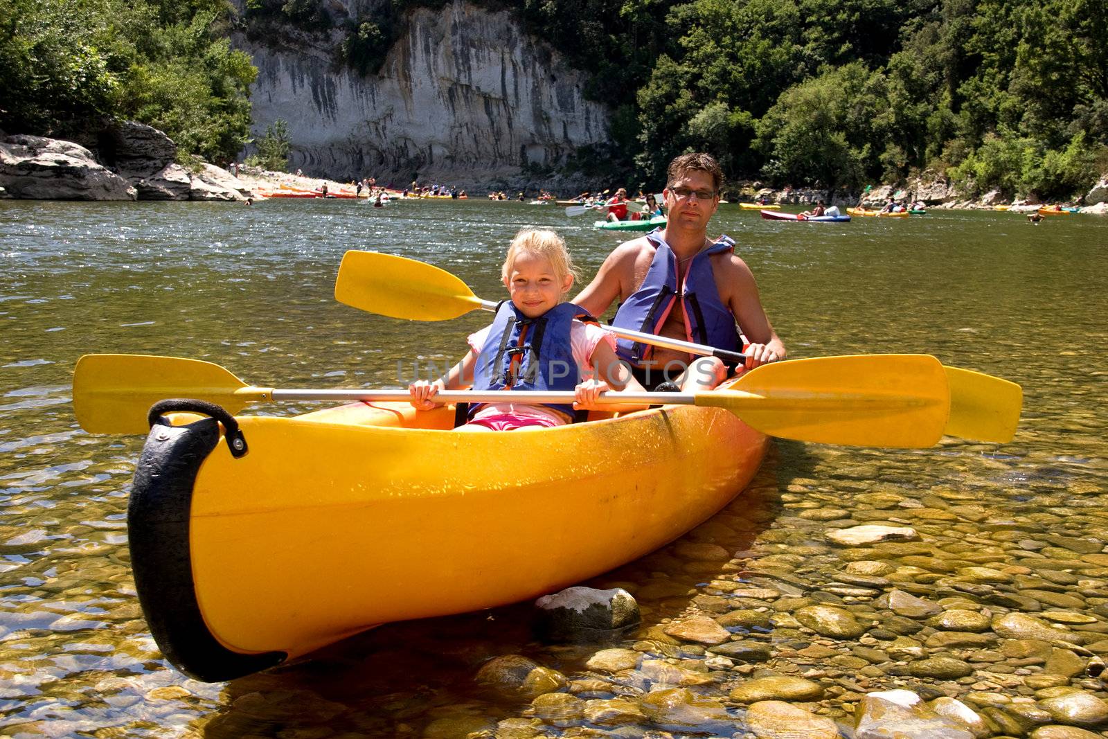 Father and daughter in canoe enjoying the holidays
