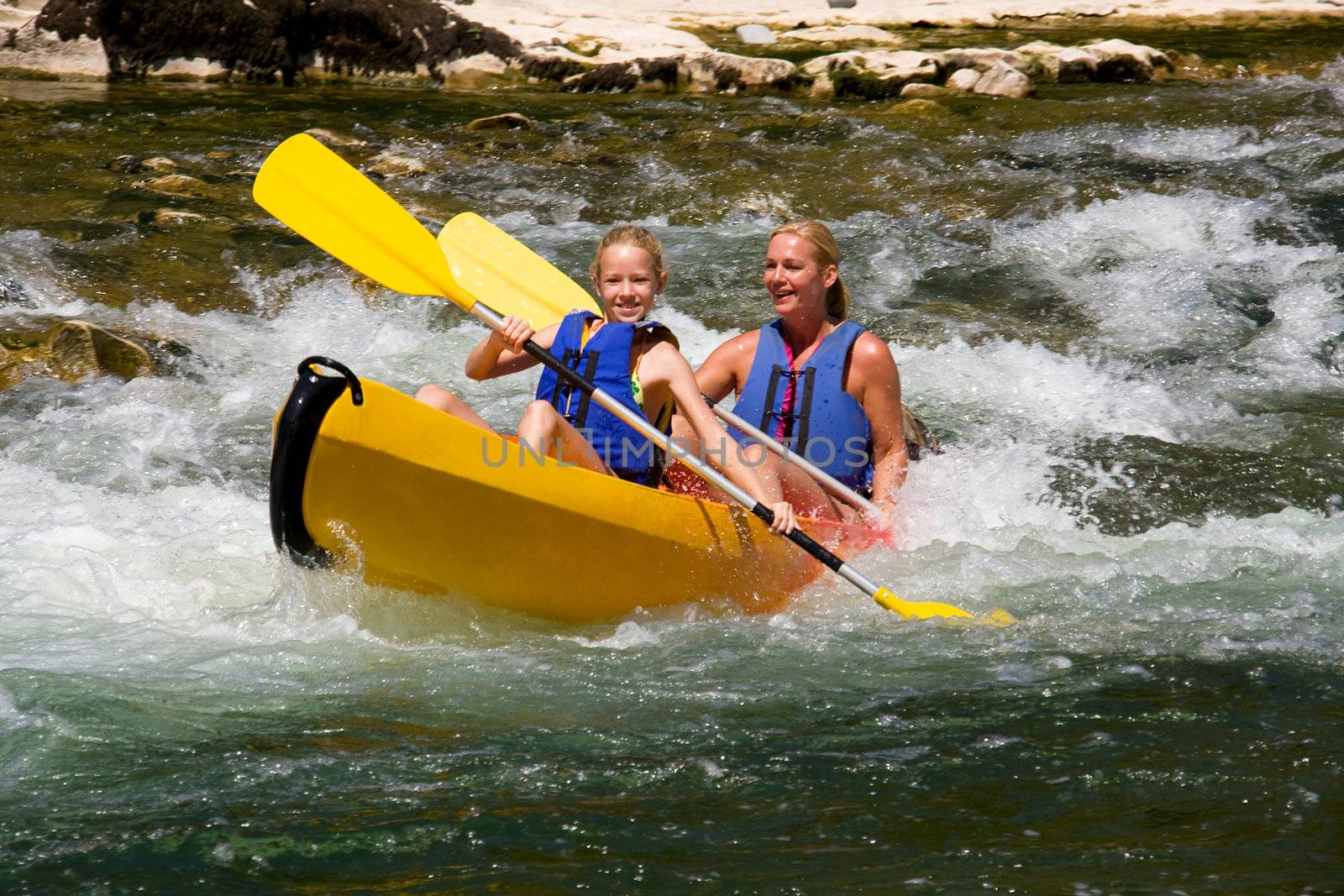 Two people in canoe enjoying holidays and nice weather