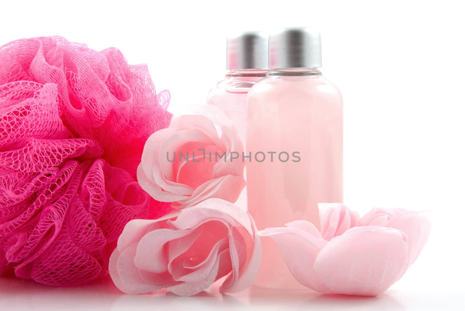 Pink colored bath accessory over white background