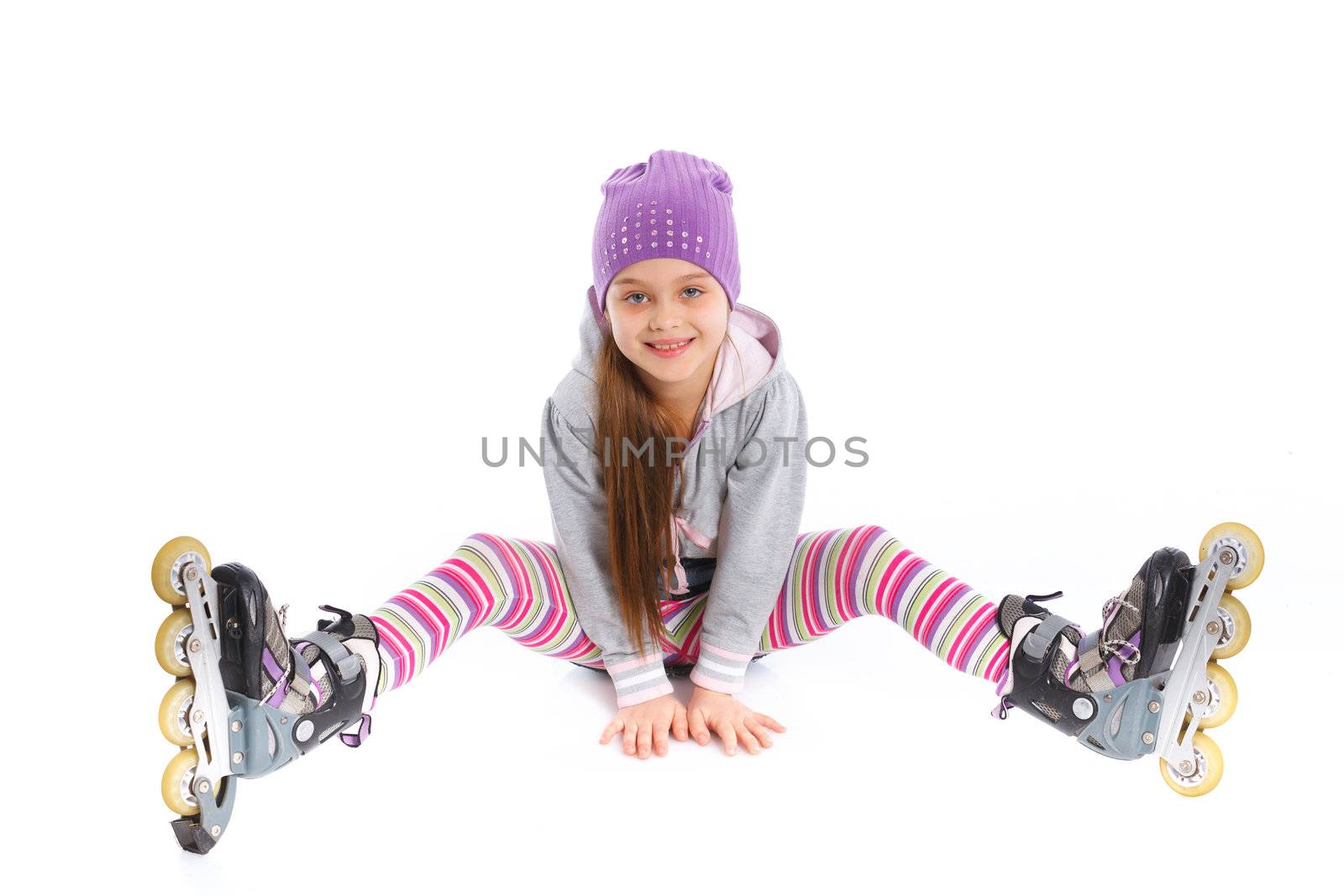 Cute girl in roller skates on a white background