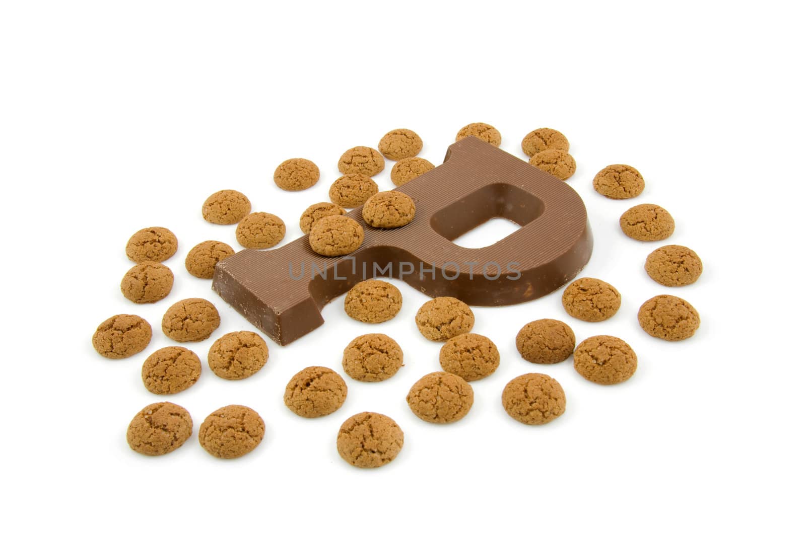 Chocolate letter P and ginger nuts for Sinterklaas, event in the Dutch in december, over white background