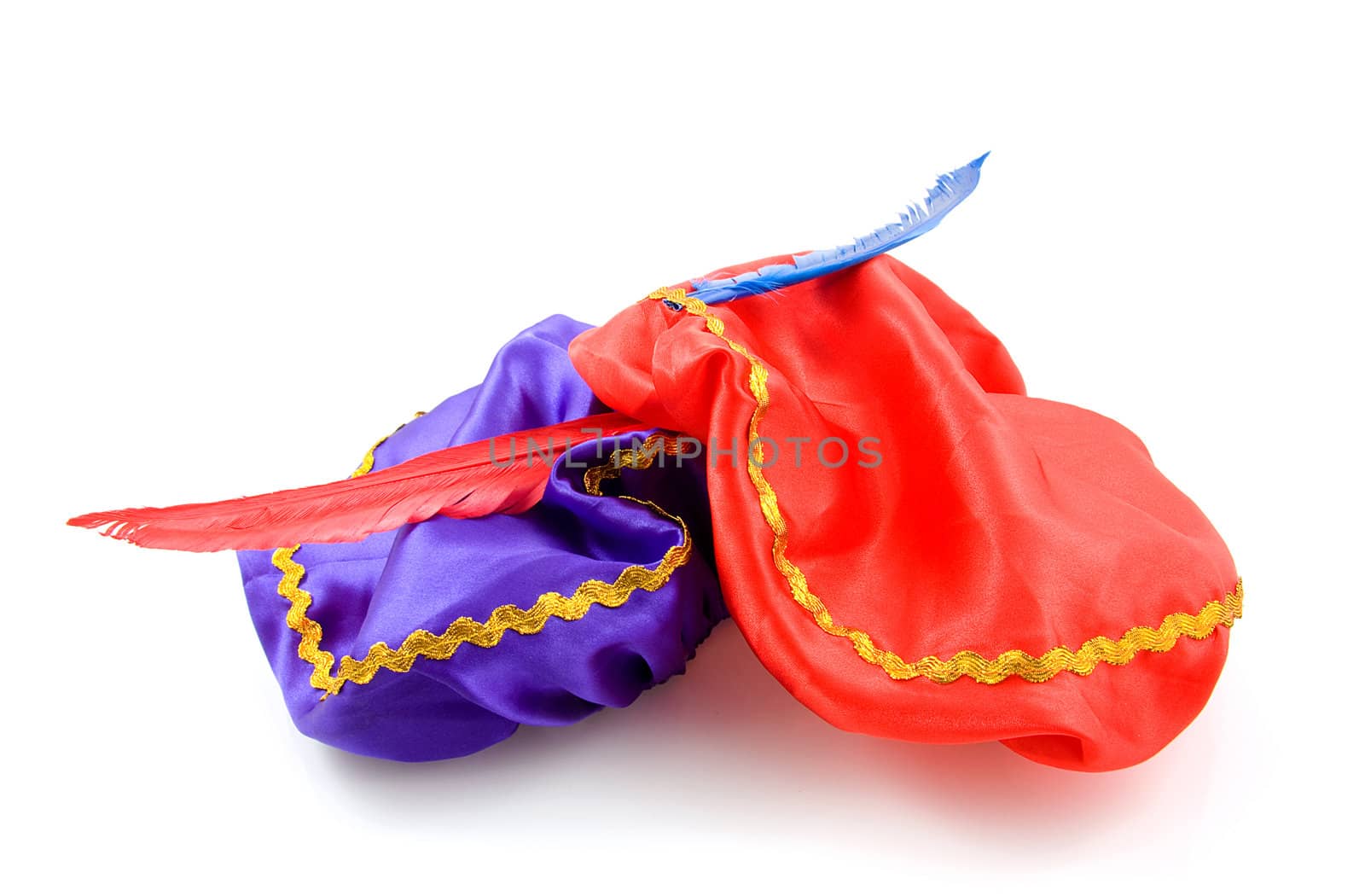 purple and red hat with red feather of Zwarte Piet for typical Dutch event in december, isolated on white background
