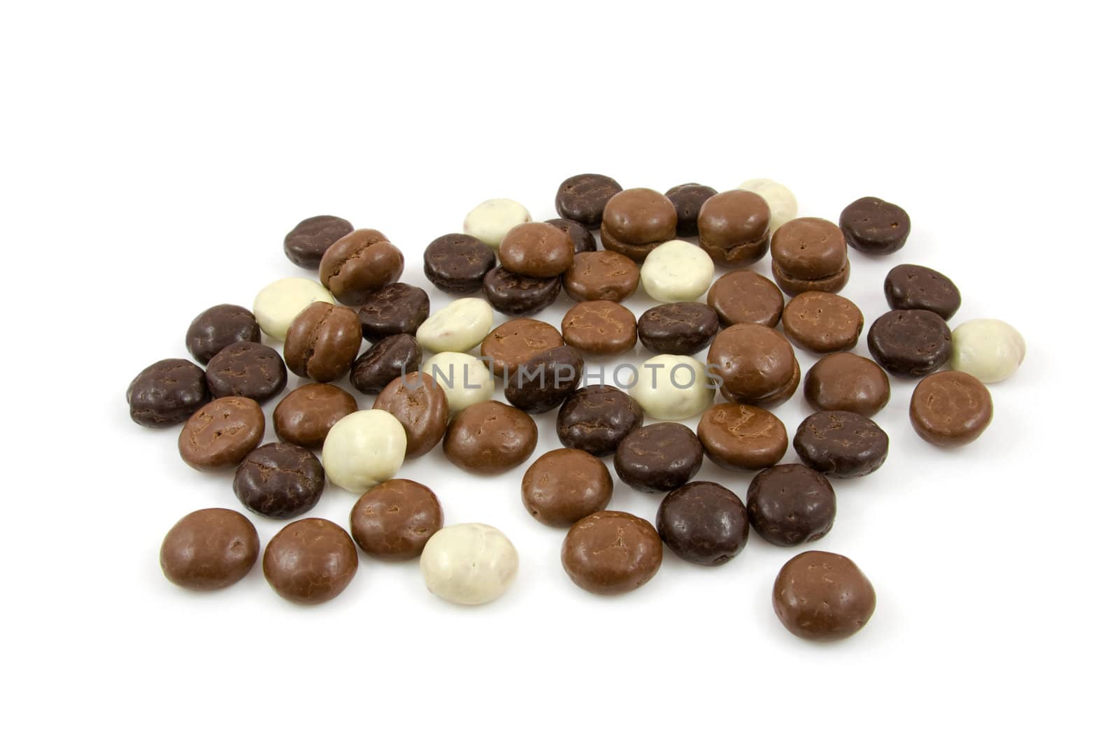 chocolate gingernuts, pepernoten,over white background. Tyical Dutch candy for 5 december.
