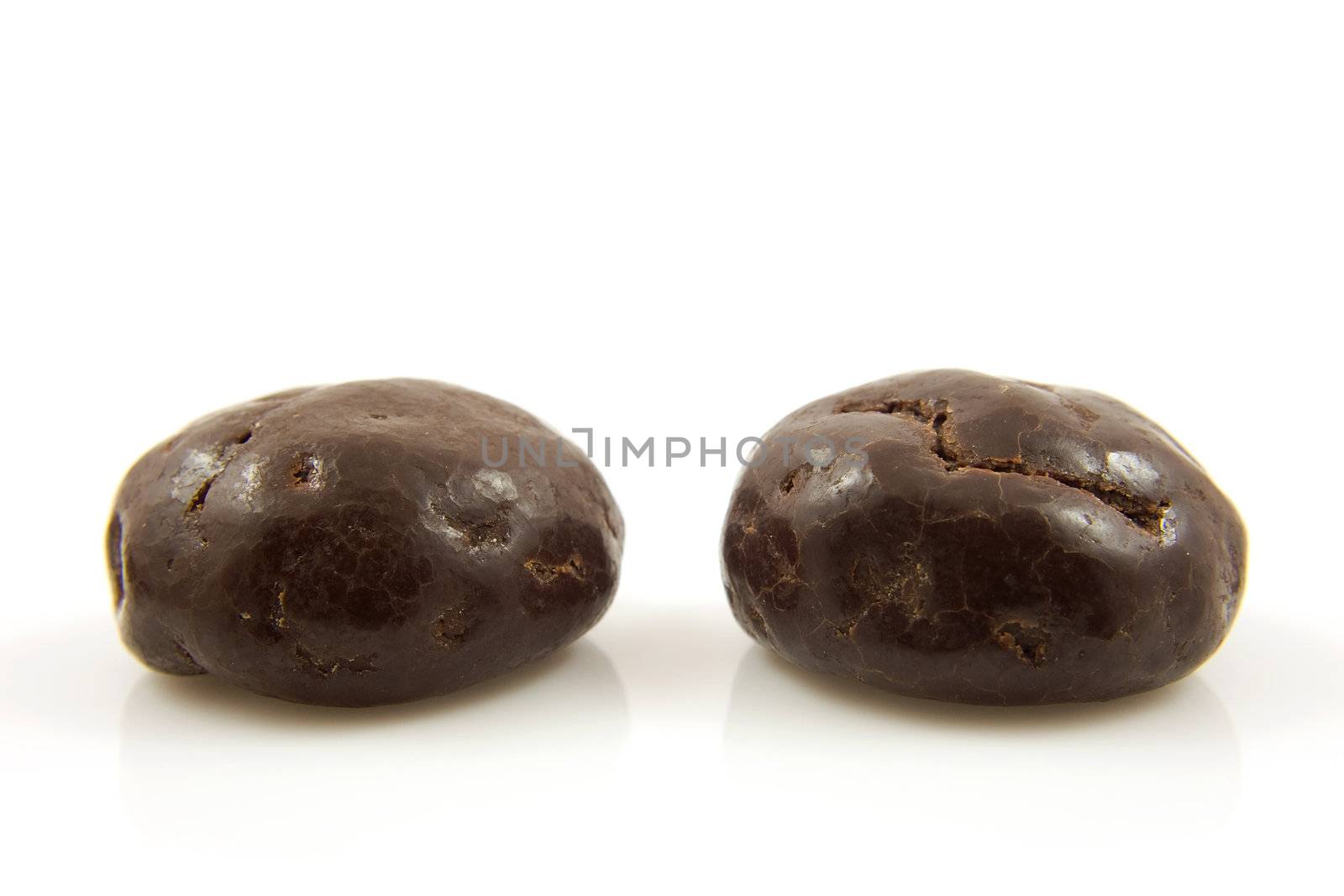 Two chocolate ginger nuts in closeup, also known as pepernoten, a typical dutch treat for Sinterklaas