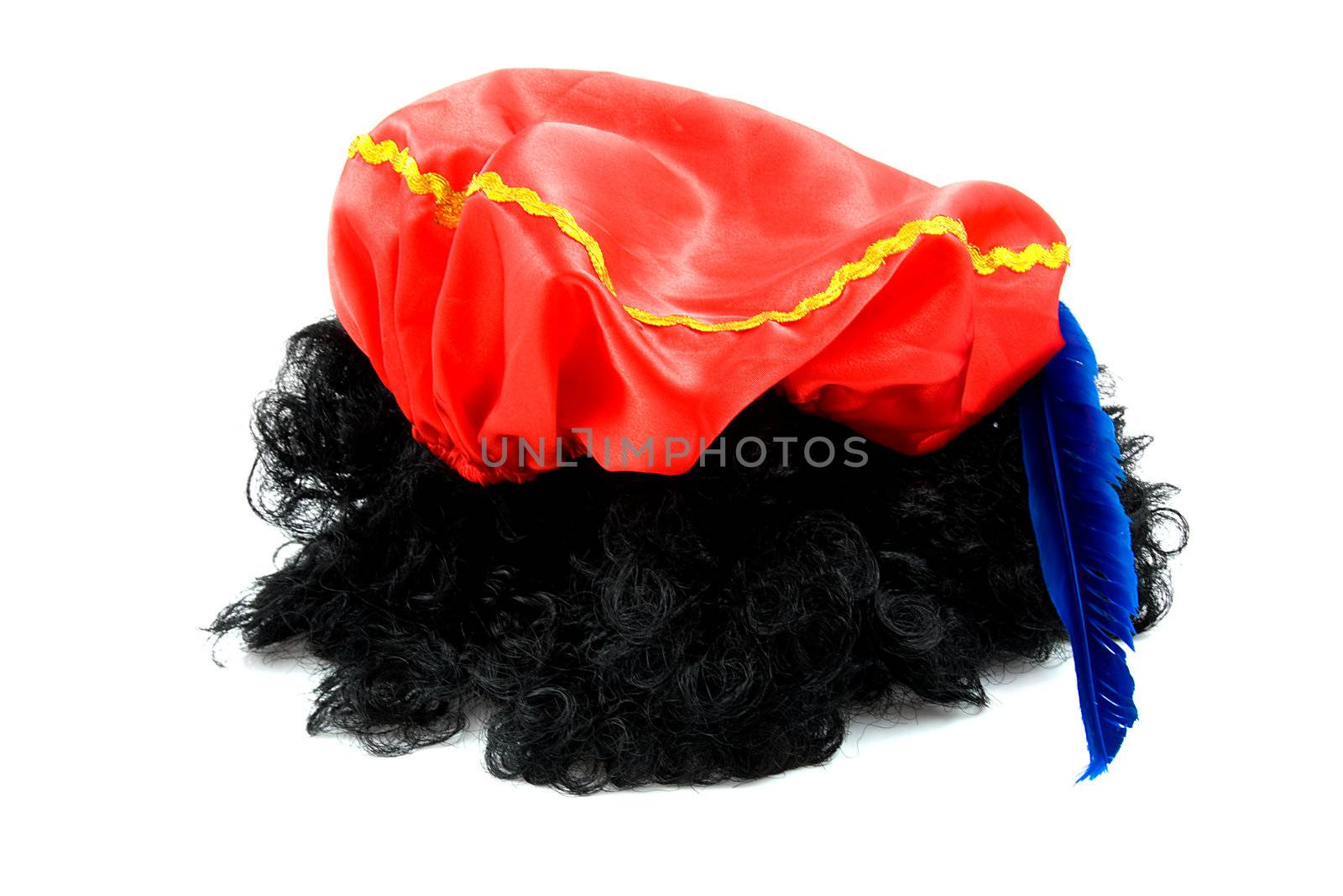 red hat with blue feather and black hair of Zwarte Piet, typical Dutch event in december