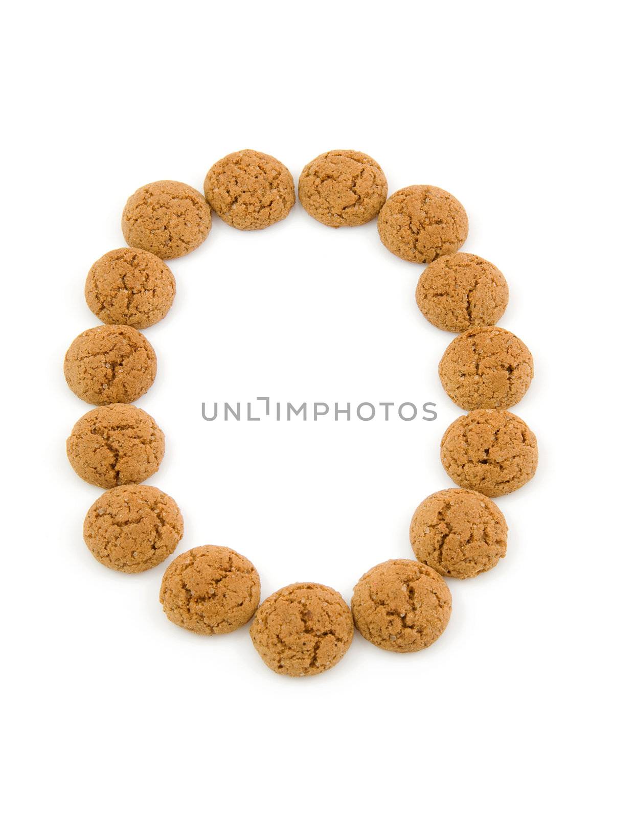 Ginger nuts, pepernoten, in the shape of letter O isolated on white background. Typical Dutch candy for Sinterklaas event in december.