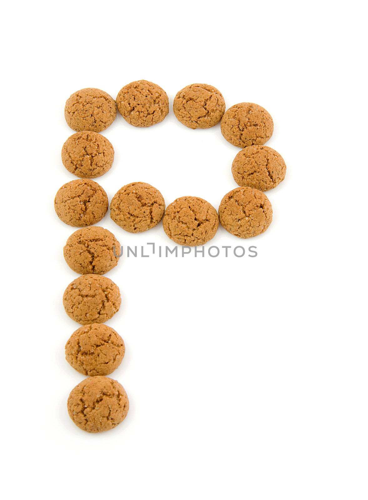Ginger nuts, pepernoten, in the shape of letter P isolated on white background. Typical Dutch candy for Sinterklaas event in december.