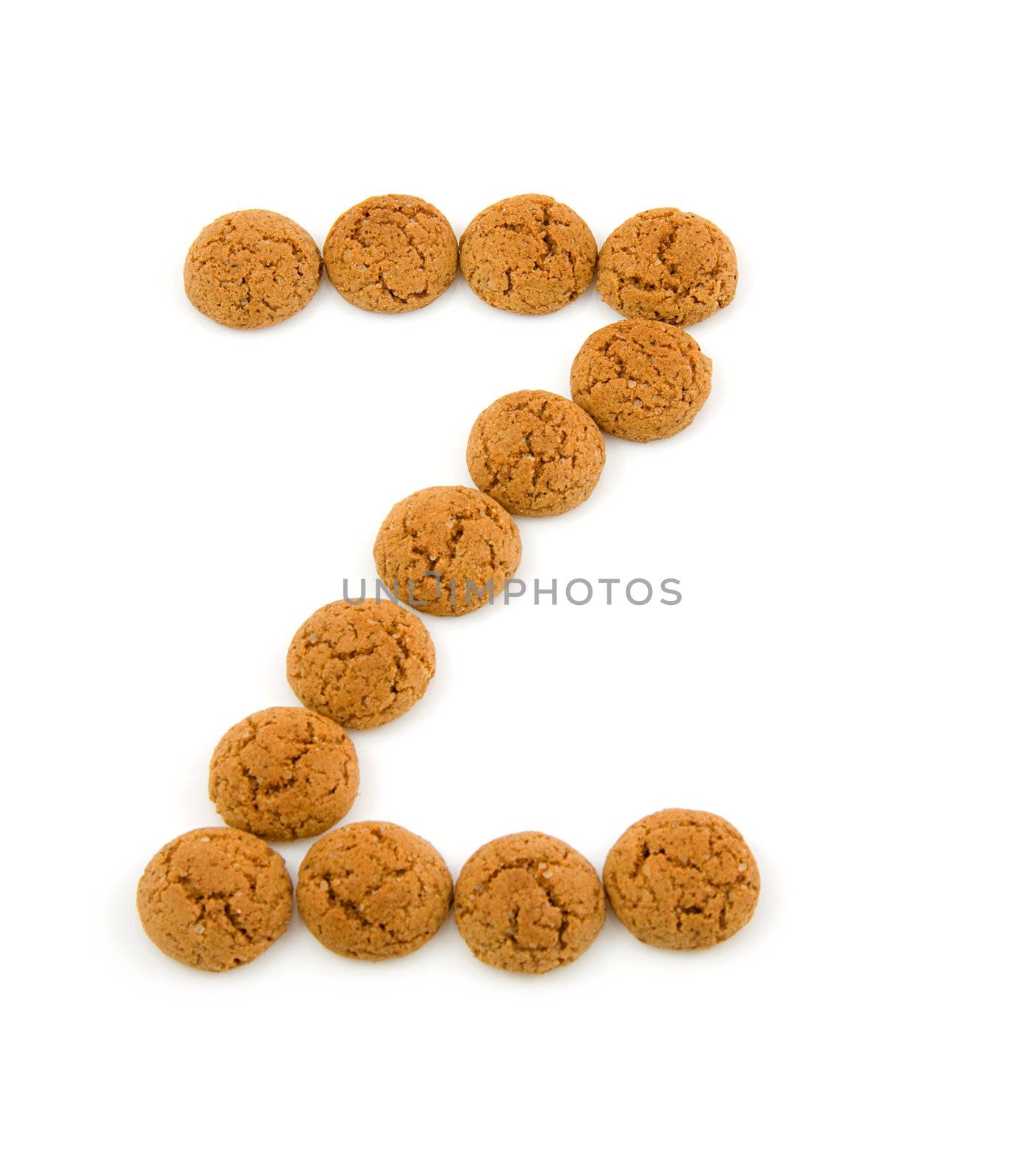 Ginger nuts, pepernoten, in the shape of letter Z isolated on white background. Typical Dutch candy for Sinterklaas event in december.
