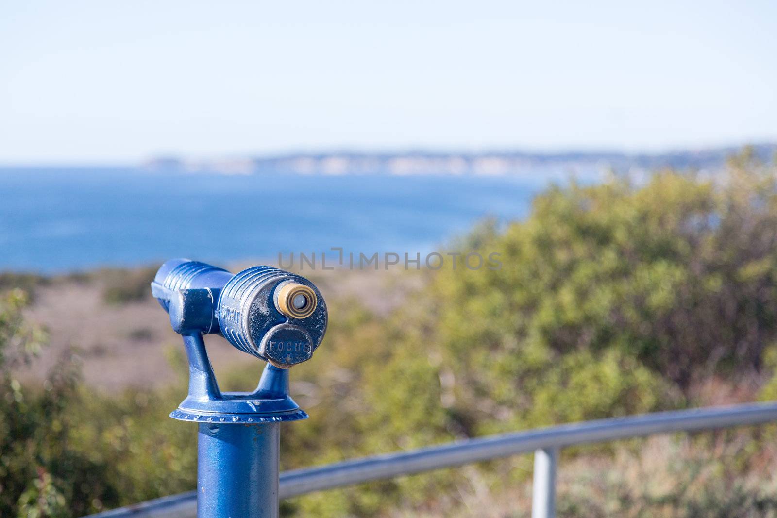 Blue painted telescope on California coast near Malibu