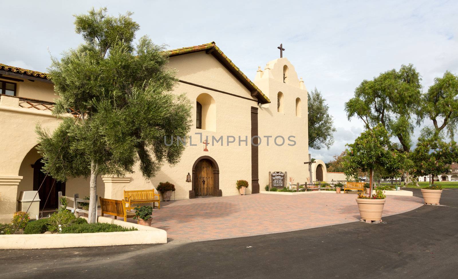 Mission Santa Ines in California exterior on sunny day with clouds