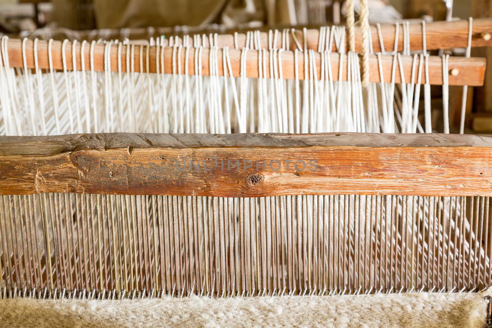 Old weaving loom made from timber making cloth in La Purisima mission California