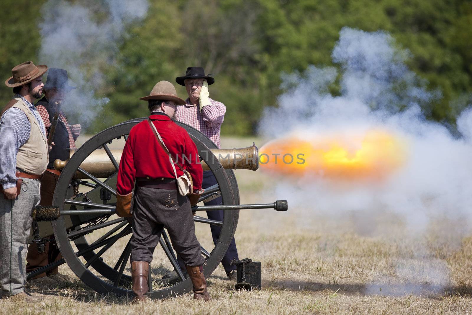 Battlefield, Missouri, USA - August 11, 2012: Civil war re-enactors fire off a cannon at Wilson's Creek National Battlefield Park in Battlefield, MO. Wilson's Creek was the first major Civil War battle fought west of the Mississippi River, and the scene of the death of general Nathaniel Lyon.