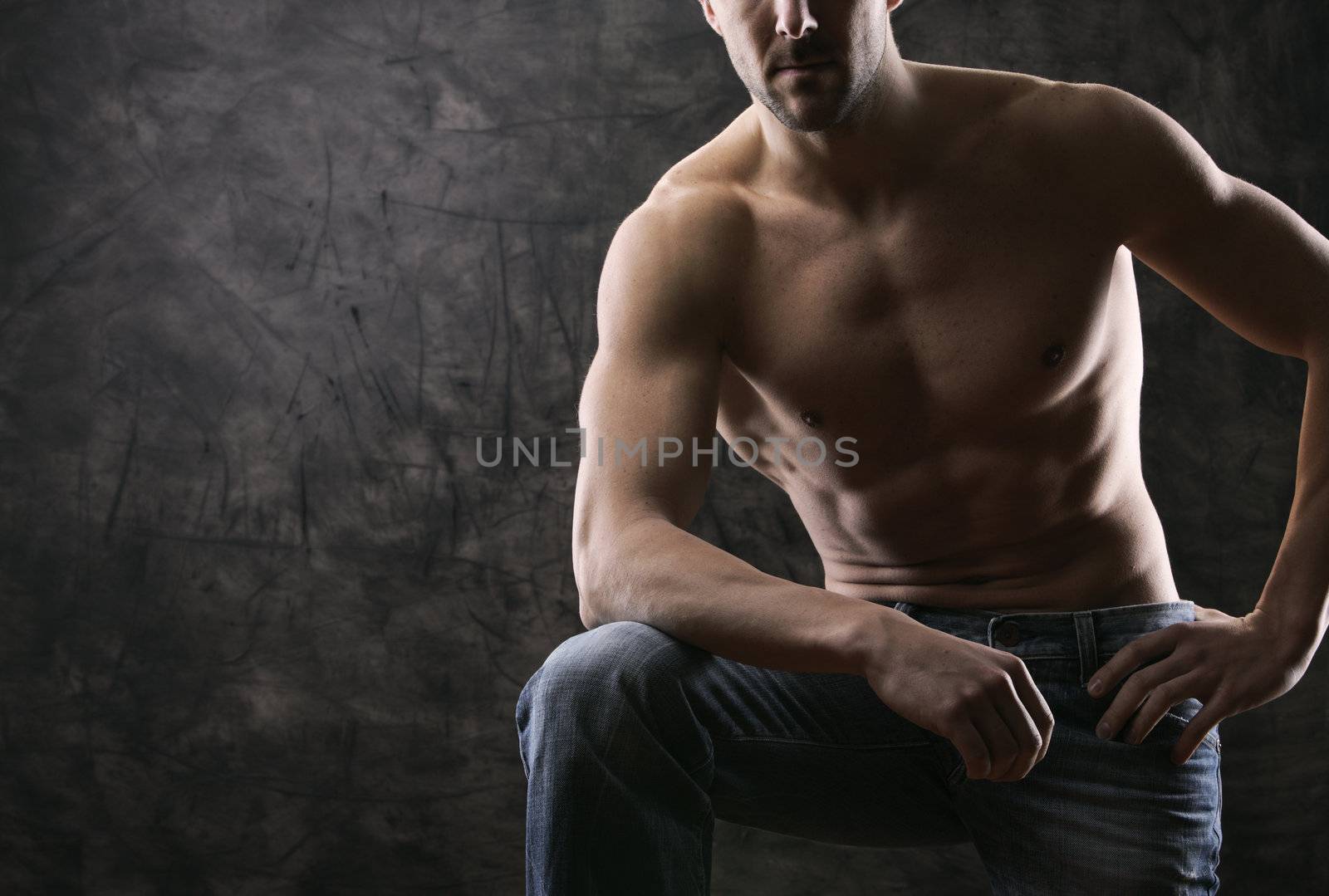 Sexy muscular man on dark background