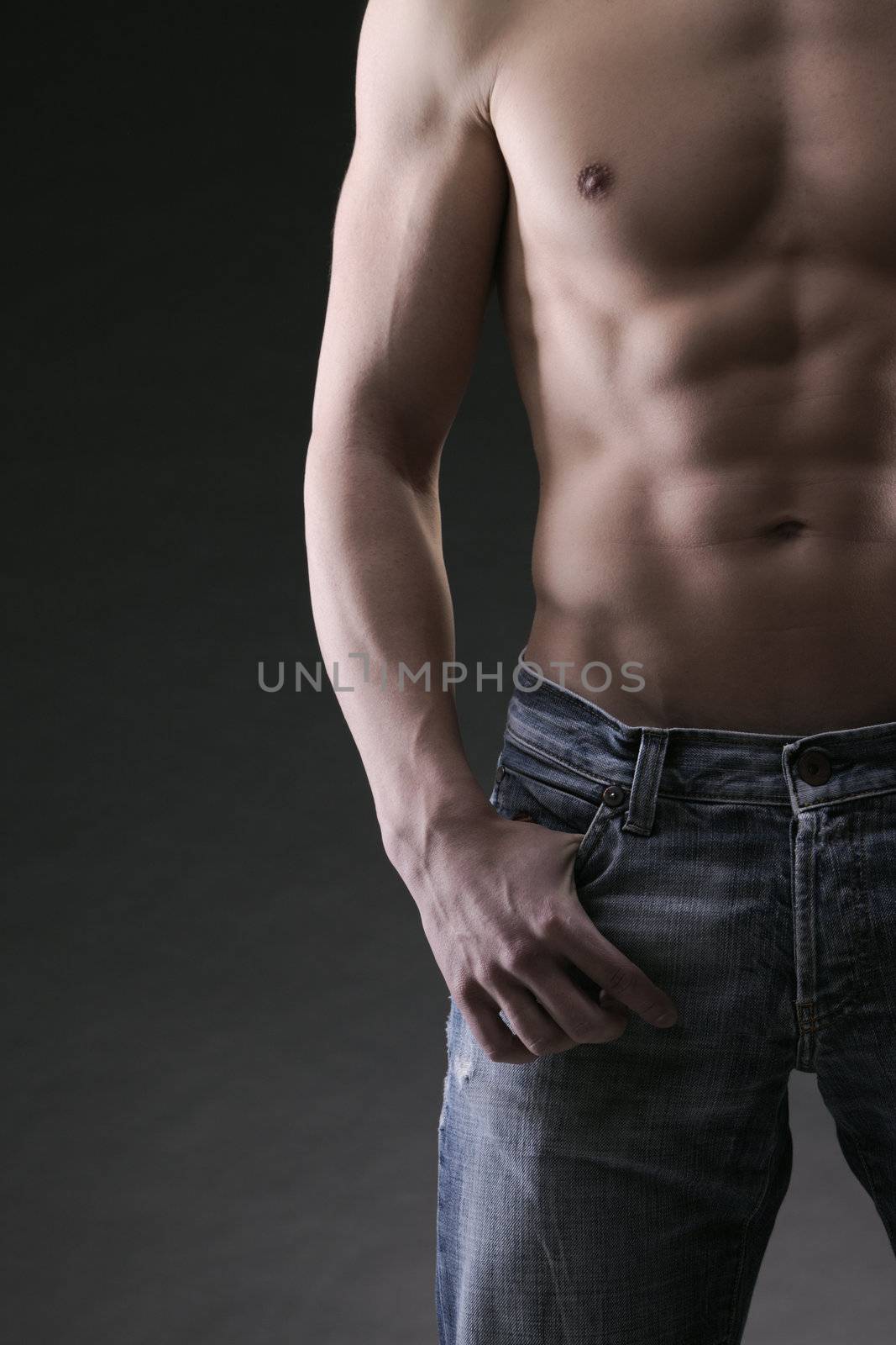 Sexy muscular man on dark background