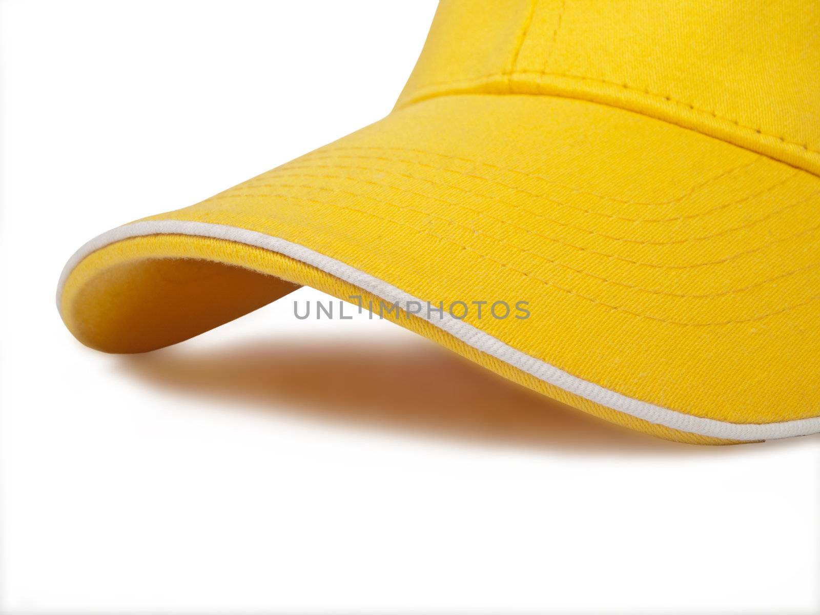 detail of yellow cap isolated on white background