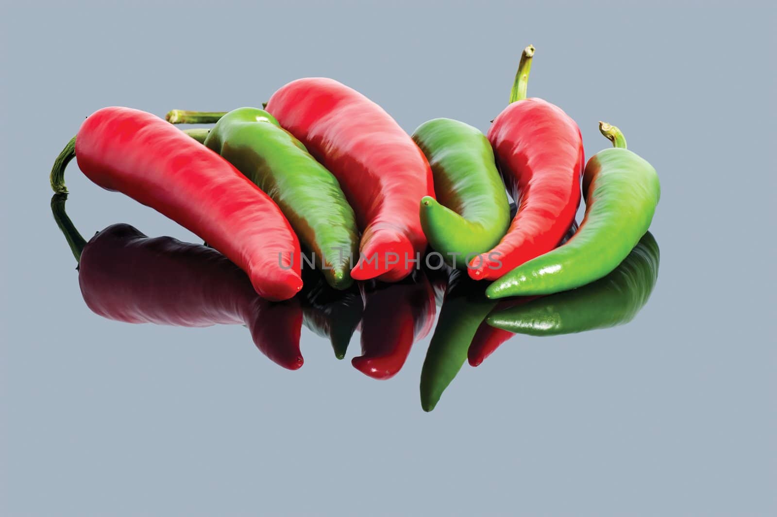 red and green hot chili peppers background by Zhukow