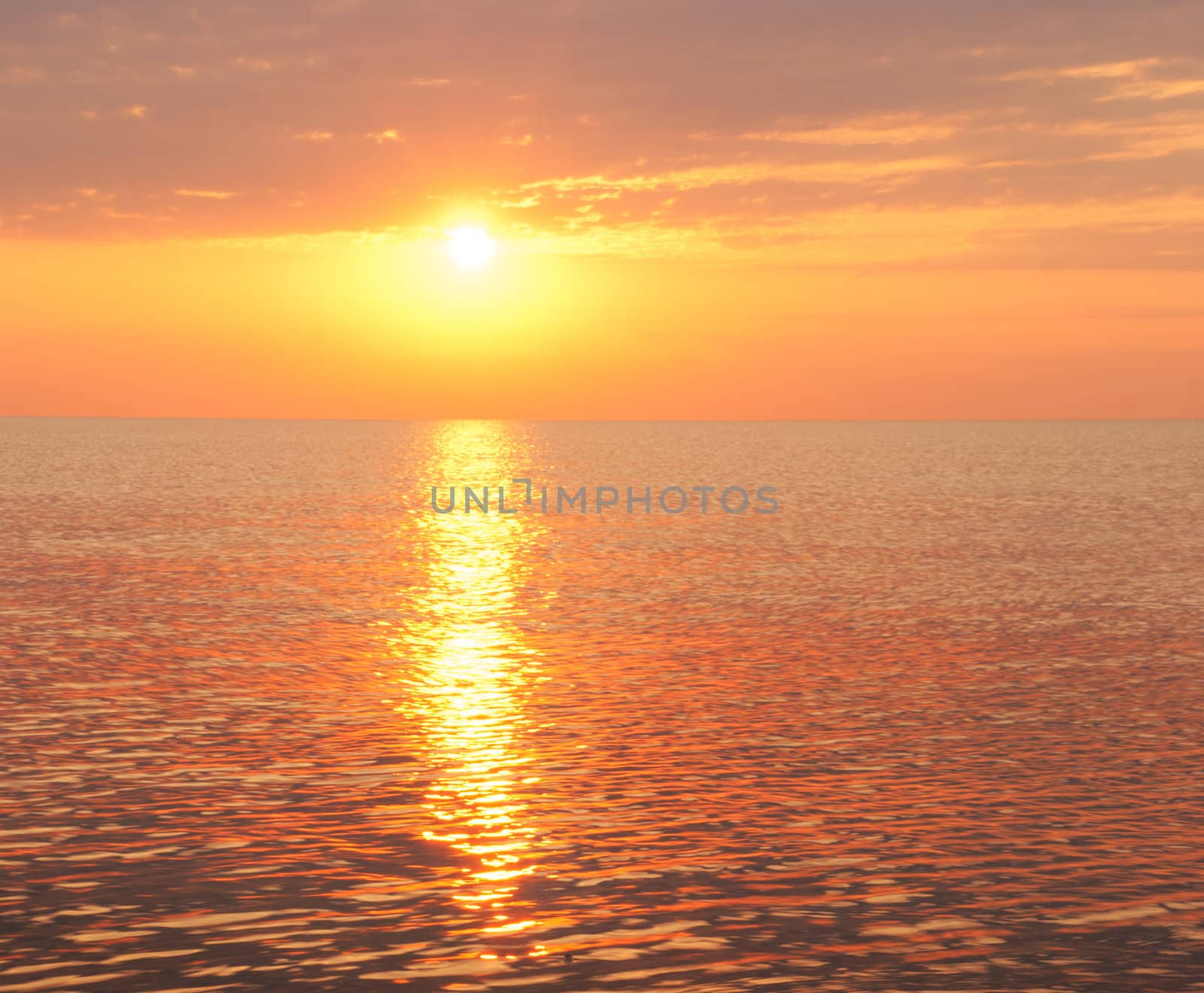 Beautiful seascape with orange warm sunrise, vacation concept